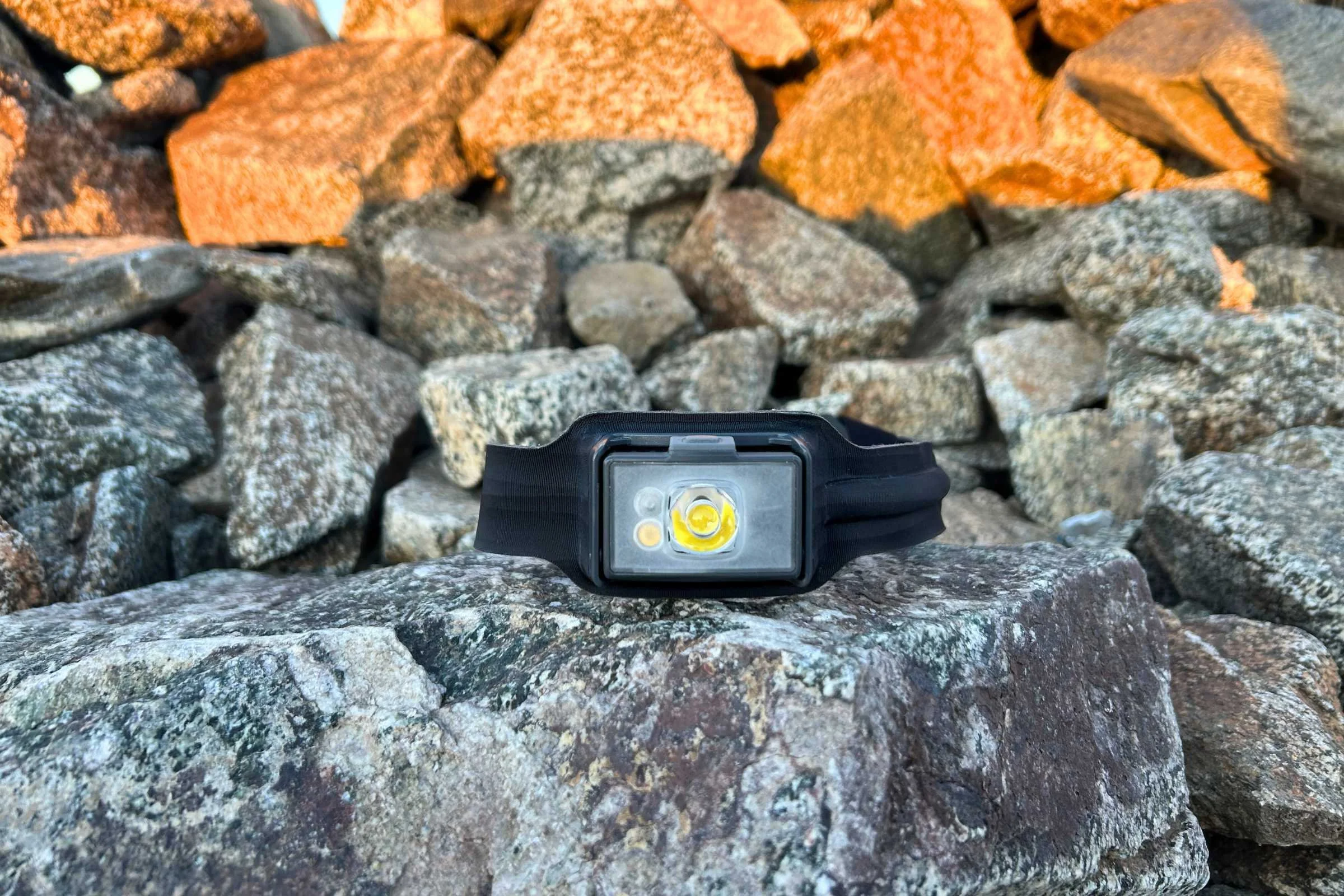 The BioLite 800 Pro on a rock with white beam on