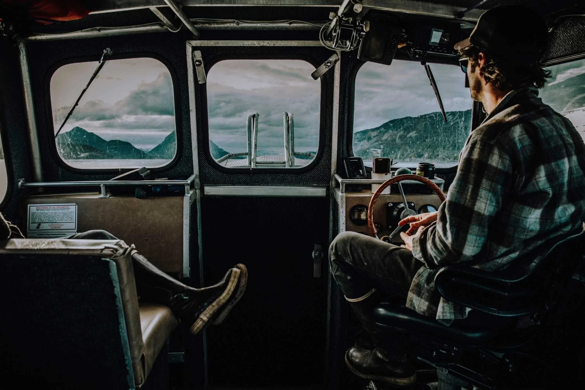 Driving boat from Haines to Skagway in Alaska while wearing the XTRATUF Legacy. We find the XTRATUF boots to be among the easiest to drive while wearing. Courtesy of Sam Ozanich