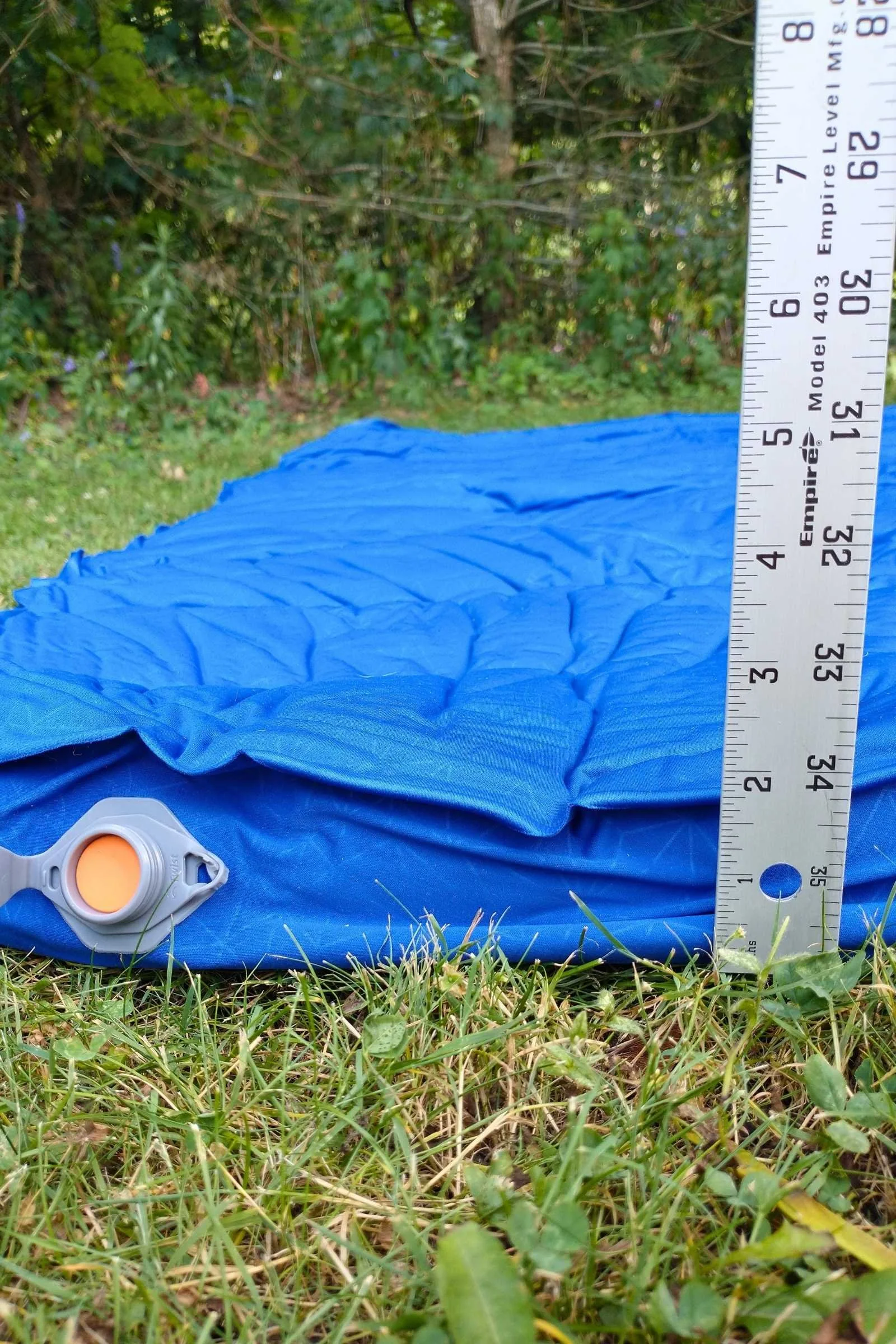 Ruler showing the Sea to Summit Comfort Deluxe sleeping pad before fully inflated