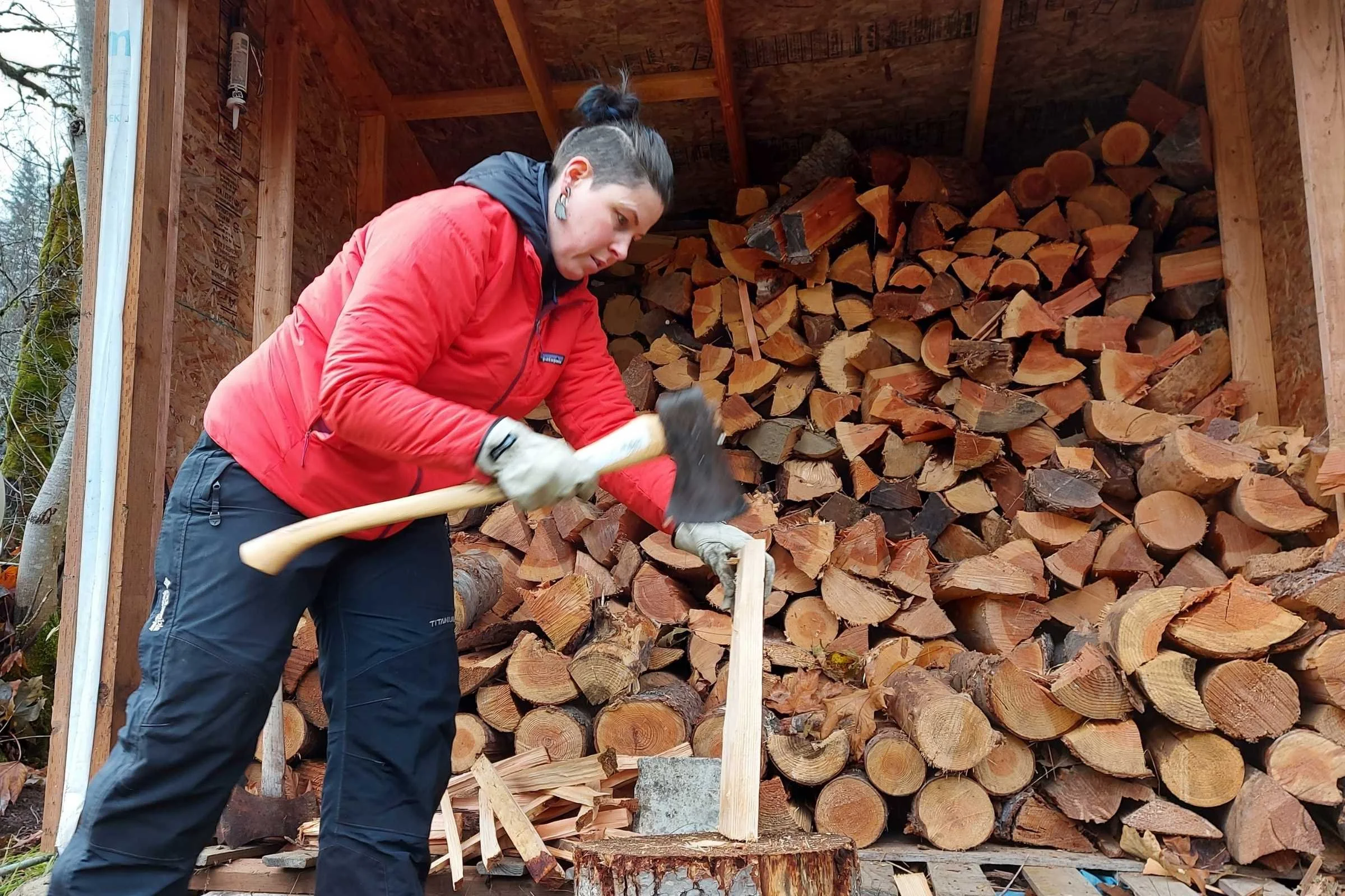   Chopping wood or other high output aerobic activities benefit from highly breathable synthetic insulation.   Photo by Adam Leckie  