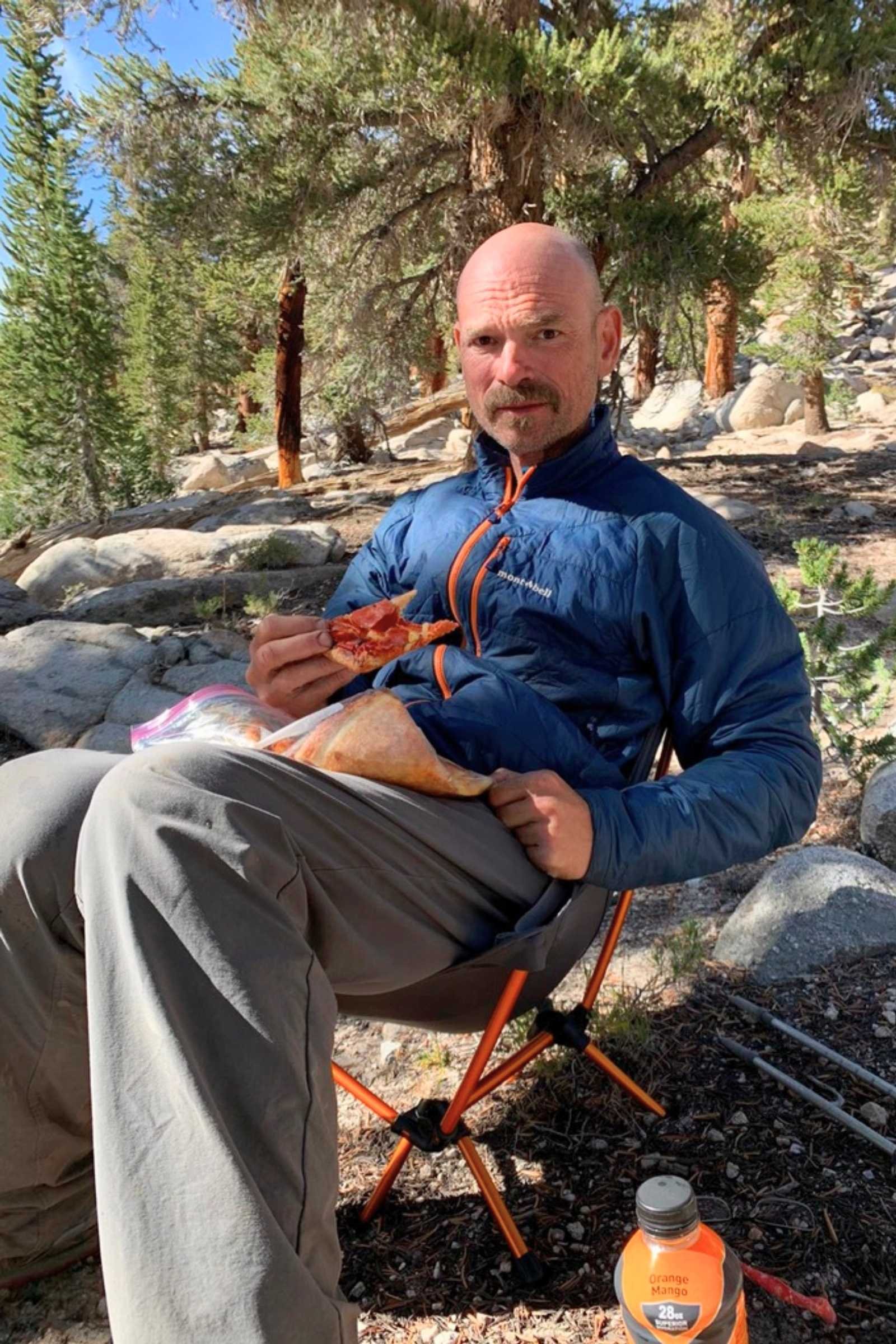   Treeline writer Mike Unger wearing the Thermawrap on his third end-to-end thru-hike of the Pacific Crest Trail. He’s taking a break at some trail magic in the Sierra.   Photo by Naomi Hudetz.  