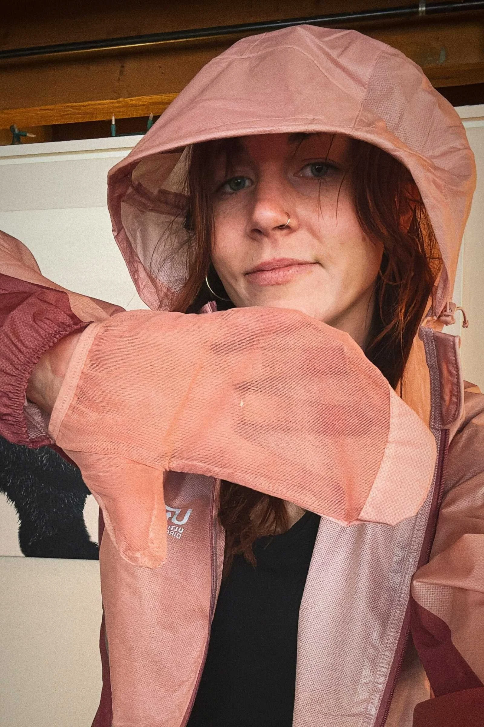   The Ultimate Direction Ultra Jacket has attached Flip Mitts for extra breathable wind and rain protection.   Photo by Becca Downs  