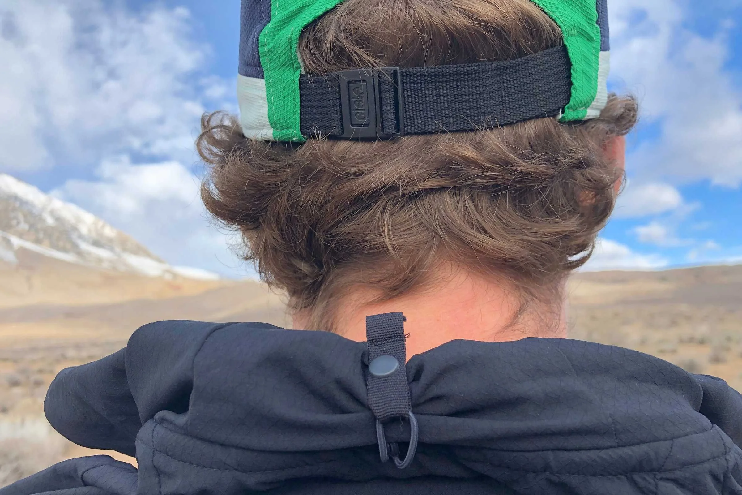   The Brooks Canopy jacket has hood storage to keep the hood in place when not used, which stops the hood from flapping loosely!   Photo by Sasha Hashemipour  