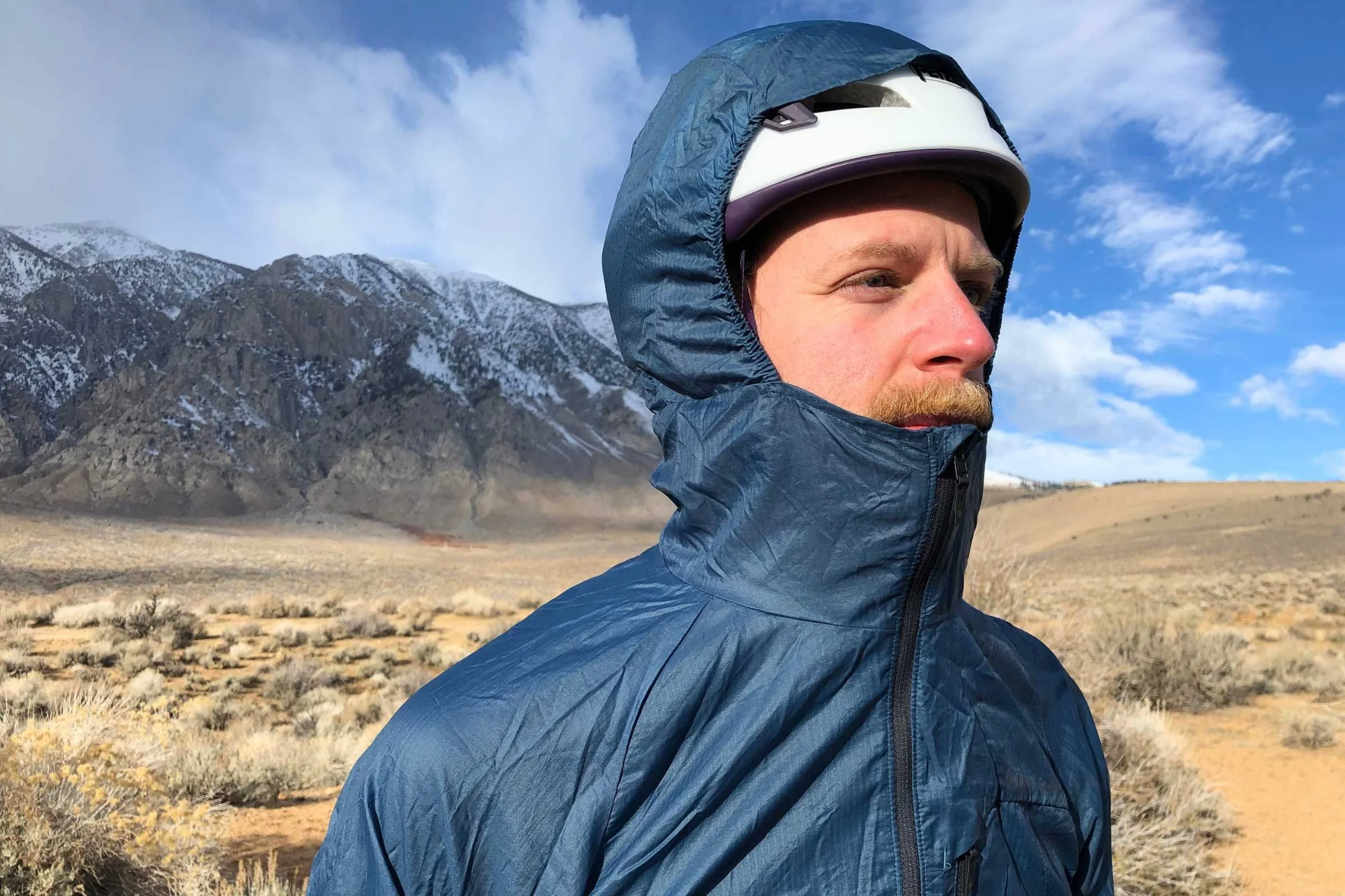   A bonus of the Black Diamond Distance is that it fits over an M/L rock climbing/ski touring helmet for those who want a jacket for rocky mountain scramble runs when a helmet is merited.   Photo by Sasha Hashemipour  