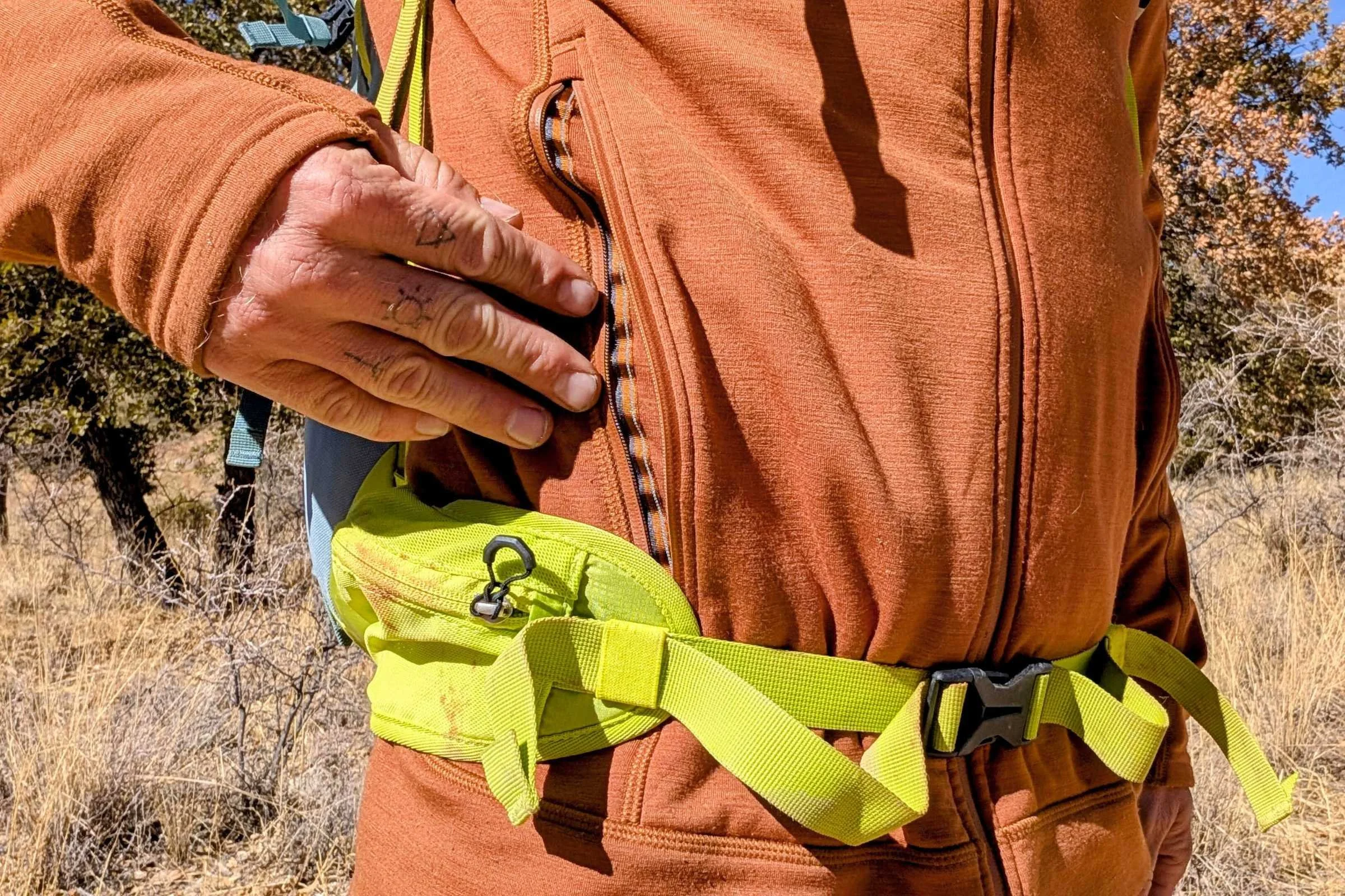   The Kuhl Dynawool’s pockets are large enough so you can still access them while wearing a hip belt.  