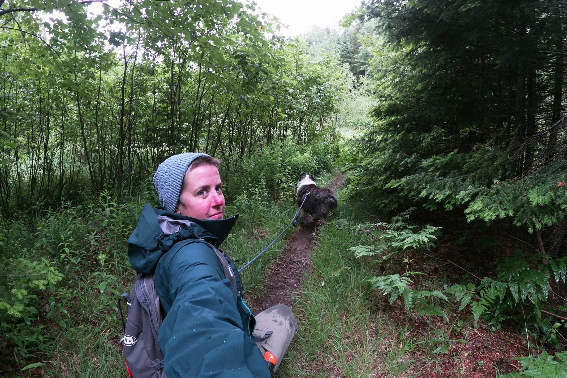  hiker wearing a blue Arc’teryx Beta AR jacket on trail 