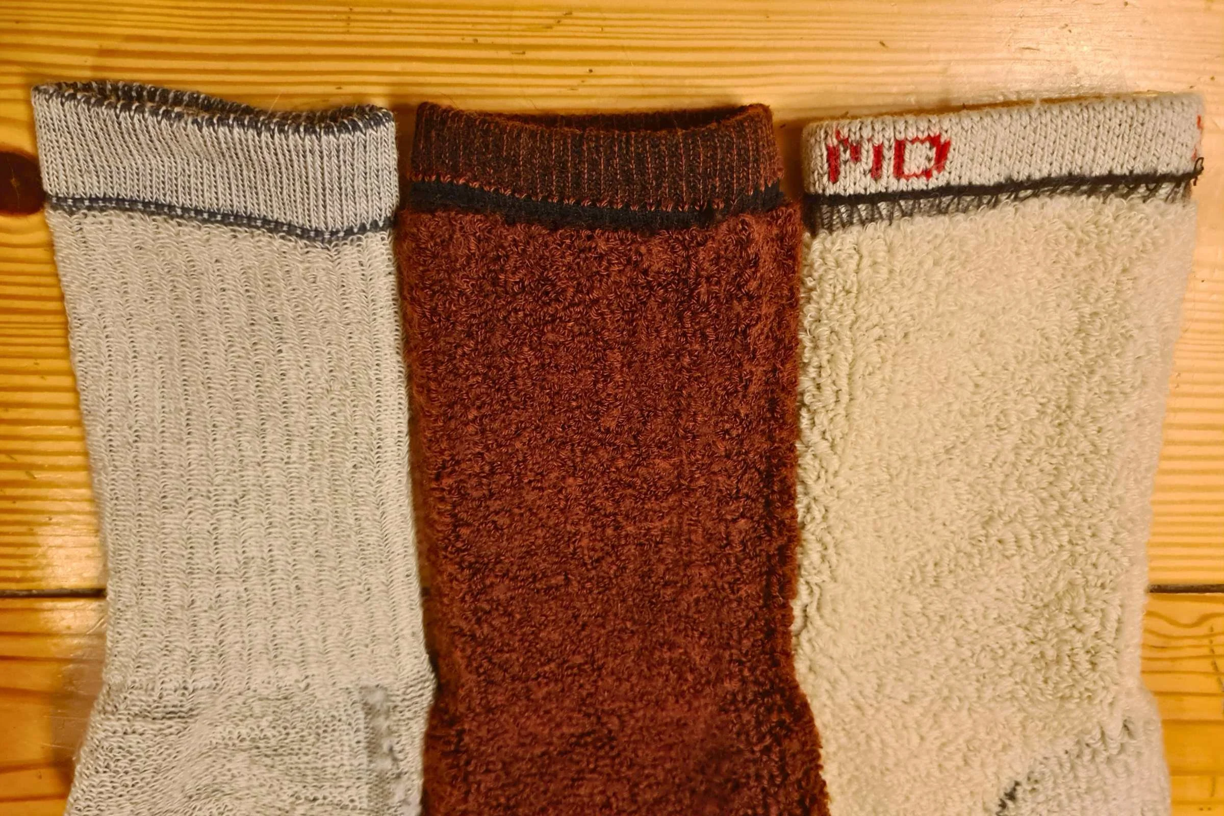   3 socks inside out so you can see the merino knit  