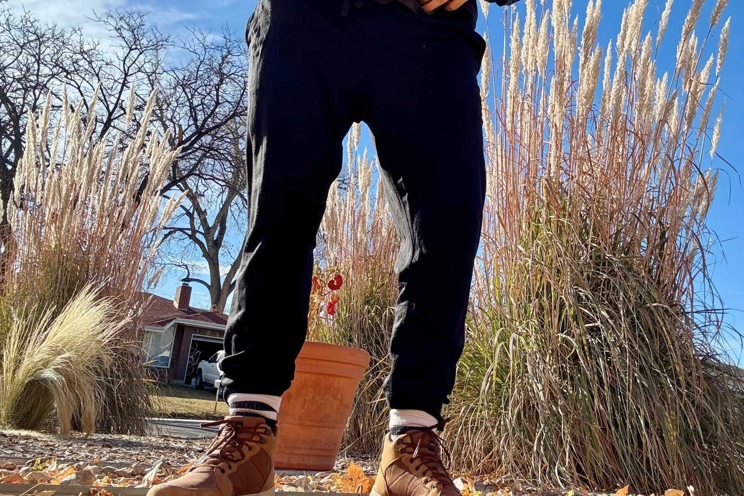  woman wearing black Ibex Nomad Joggers    