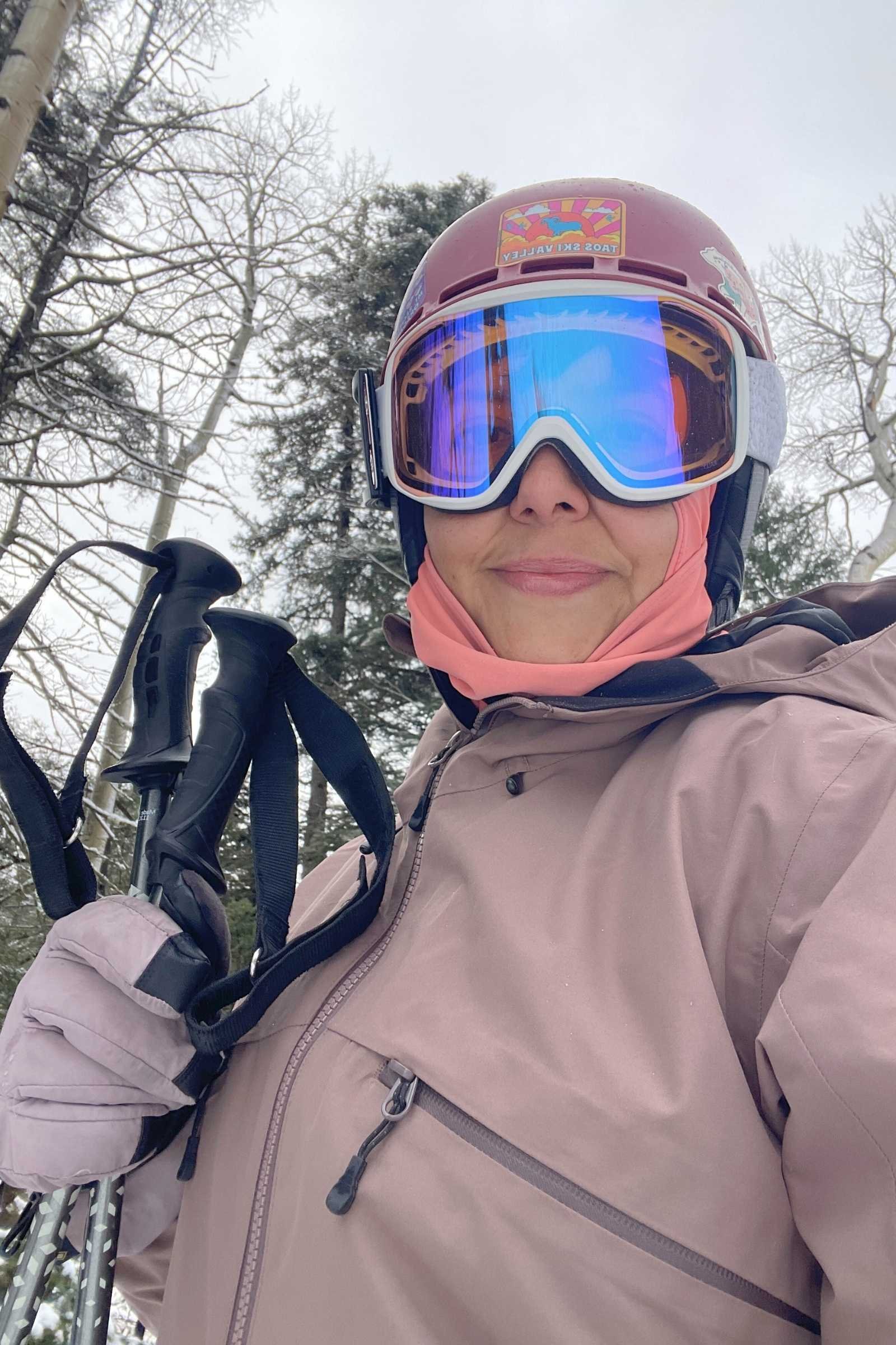  woman in ski gear wearing a purple Picture Organic Clothing U54 JKT 