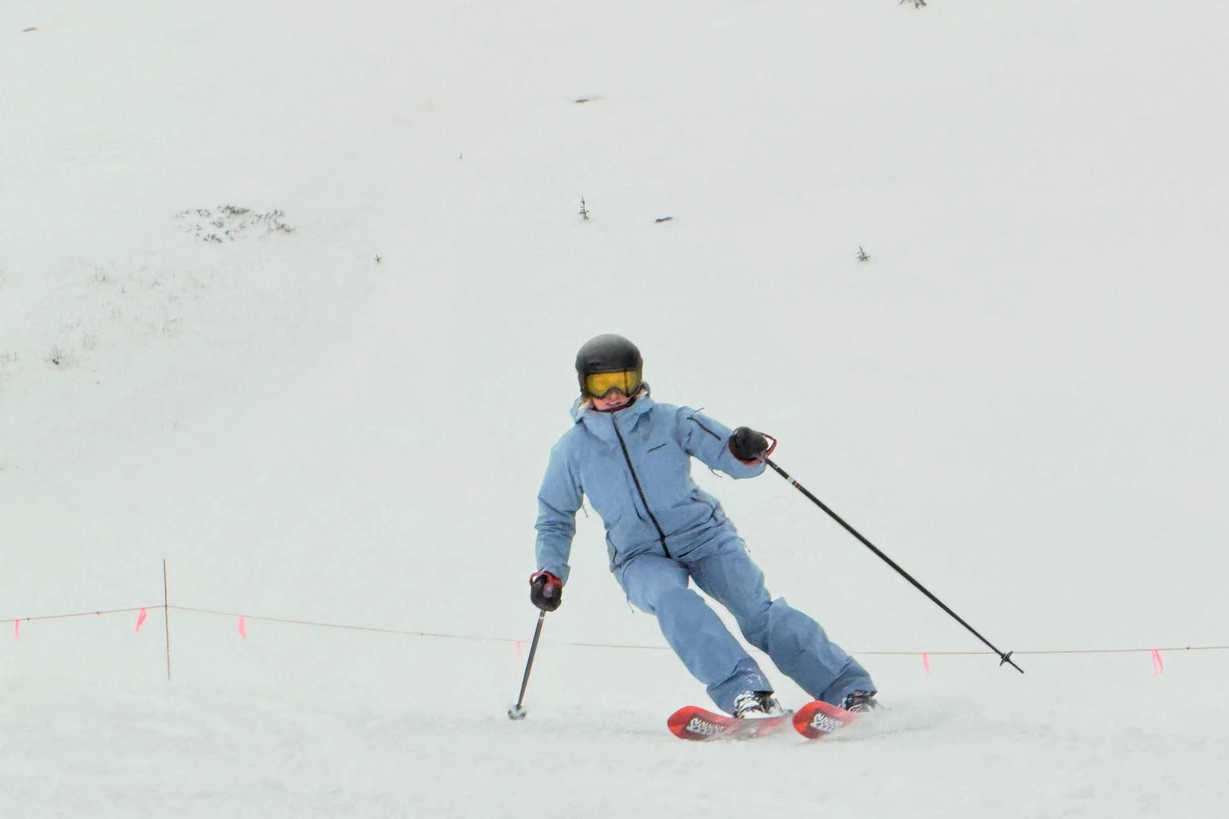   Skier carving wearing Patagonia PowSlayer jacket  