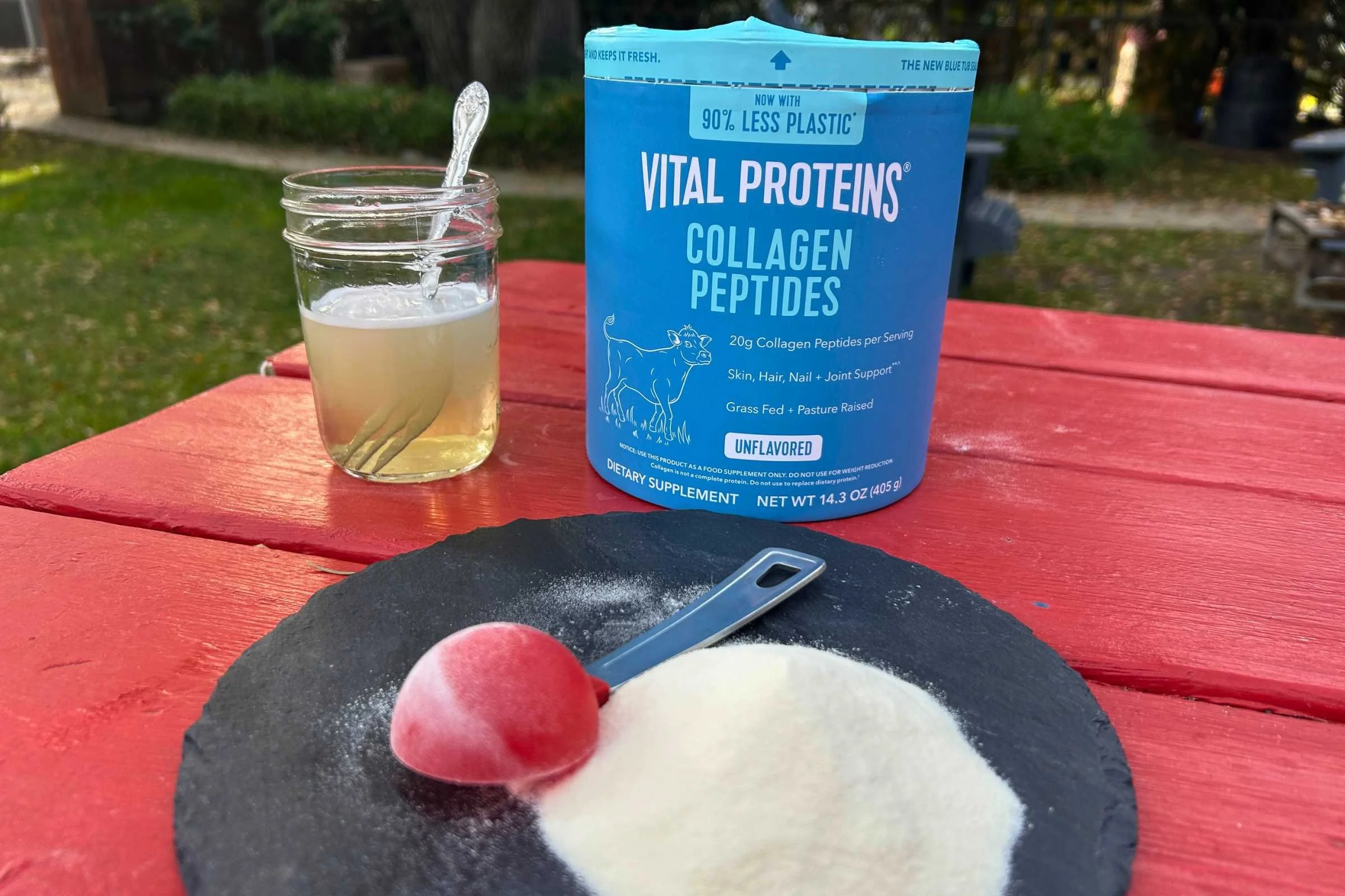   Vital Proteins Collagen Peptides powder and mixed drink on outdoor table  