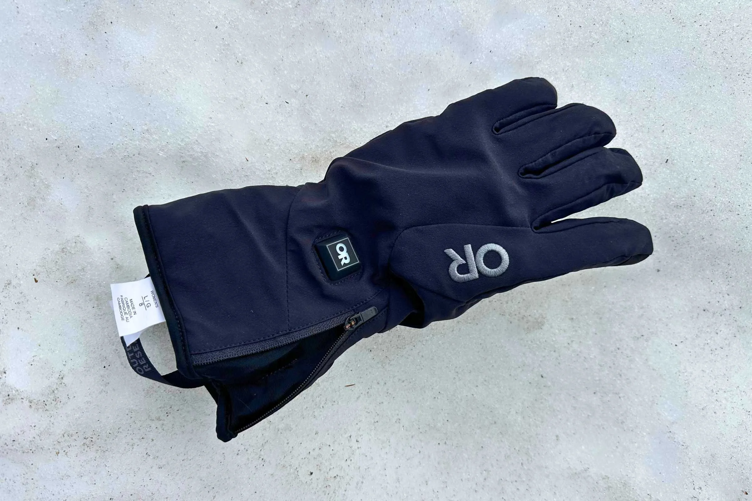   The button on the back of the Outdoor Research Sureshot Heated Gloves turns them on and off easily.   Photo courtesy Sara Kruglinski.  