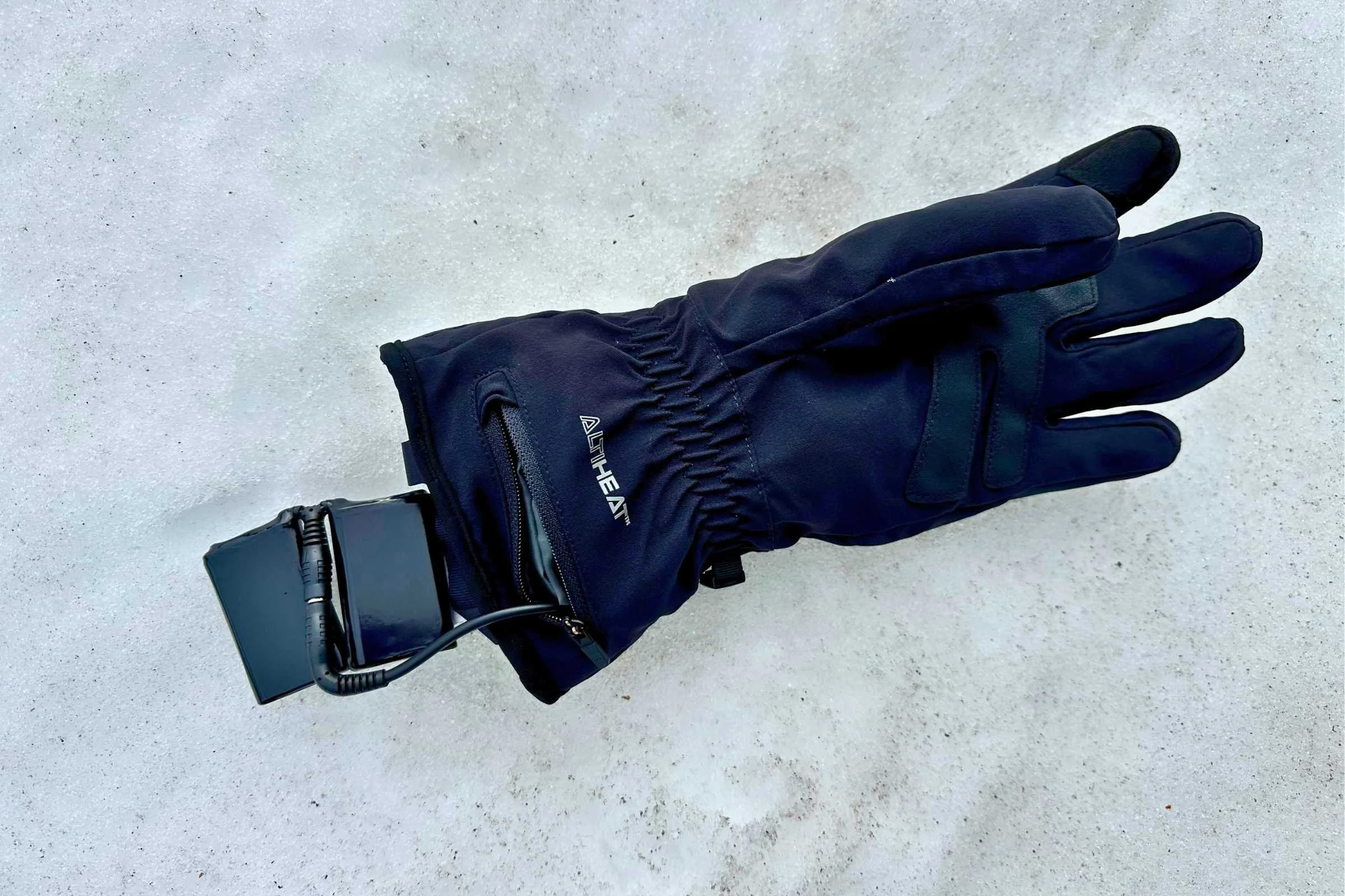   The Battery for the Outdoor Research Sureshot Heated Gloves goes into a zippered pocket for easy access to charging.   Photo courtesy Sara Kruglinski.  