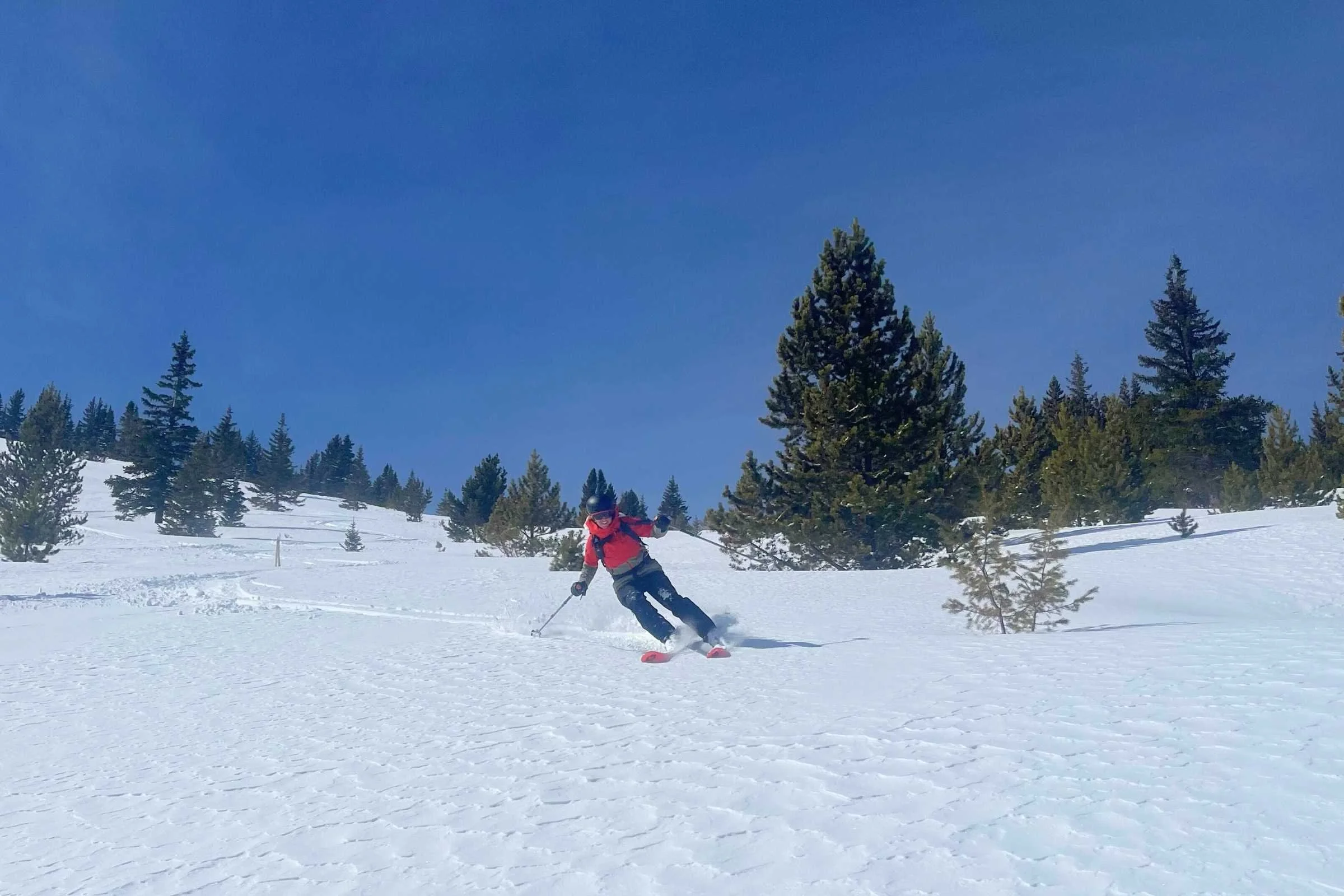   The author backcountry skiing in an older version of the Hemispheres jacket and bibs.   Photo by Jon Stockwell.  