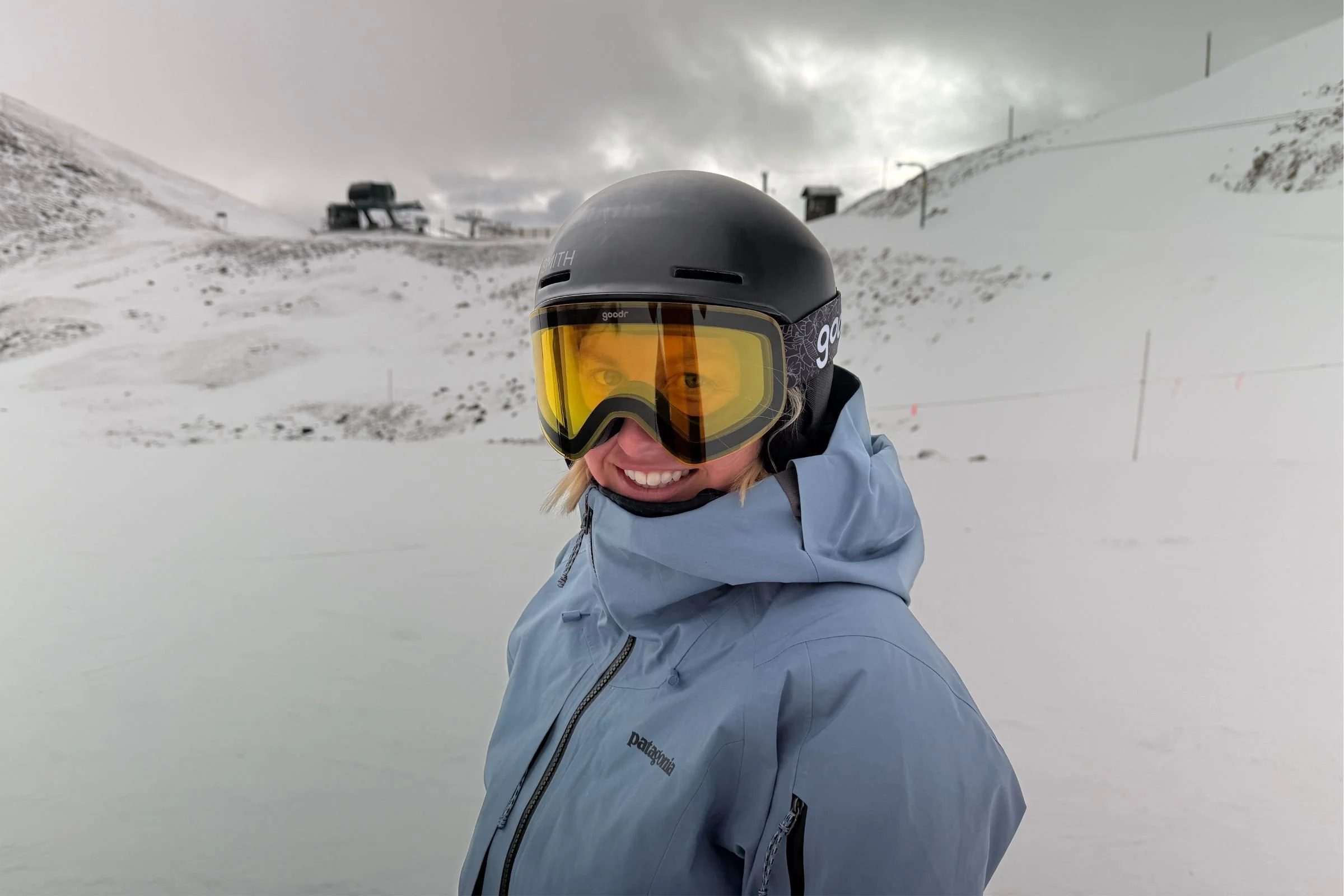   Skier wearing Goodr Snow G goggles on snowy mountain  