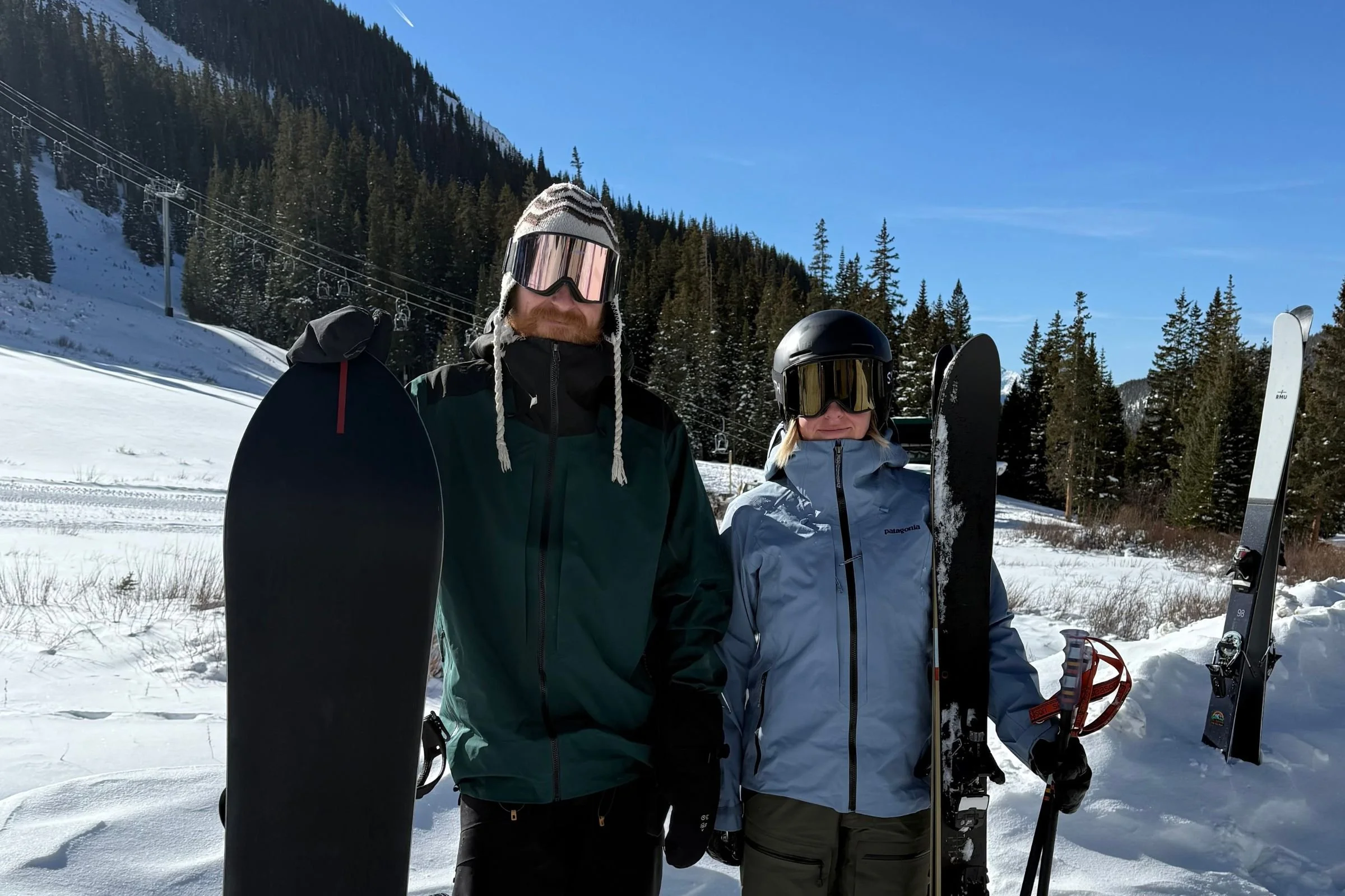   Two skiers wearing Smith Squad MAG goggles  