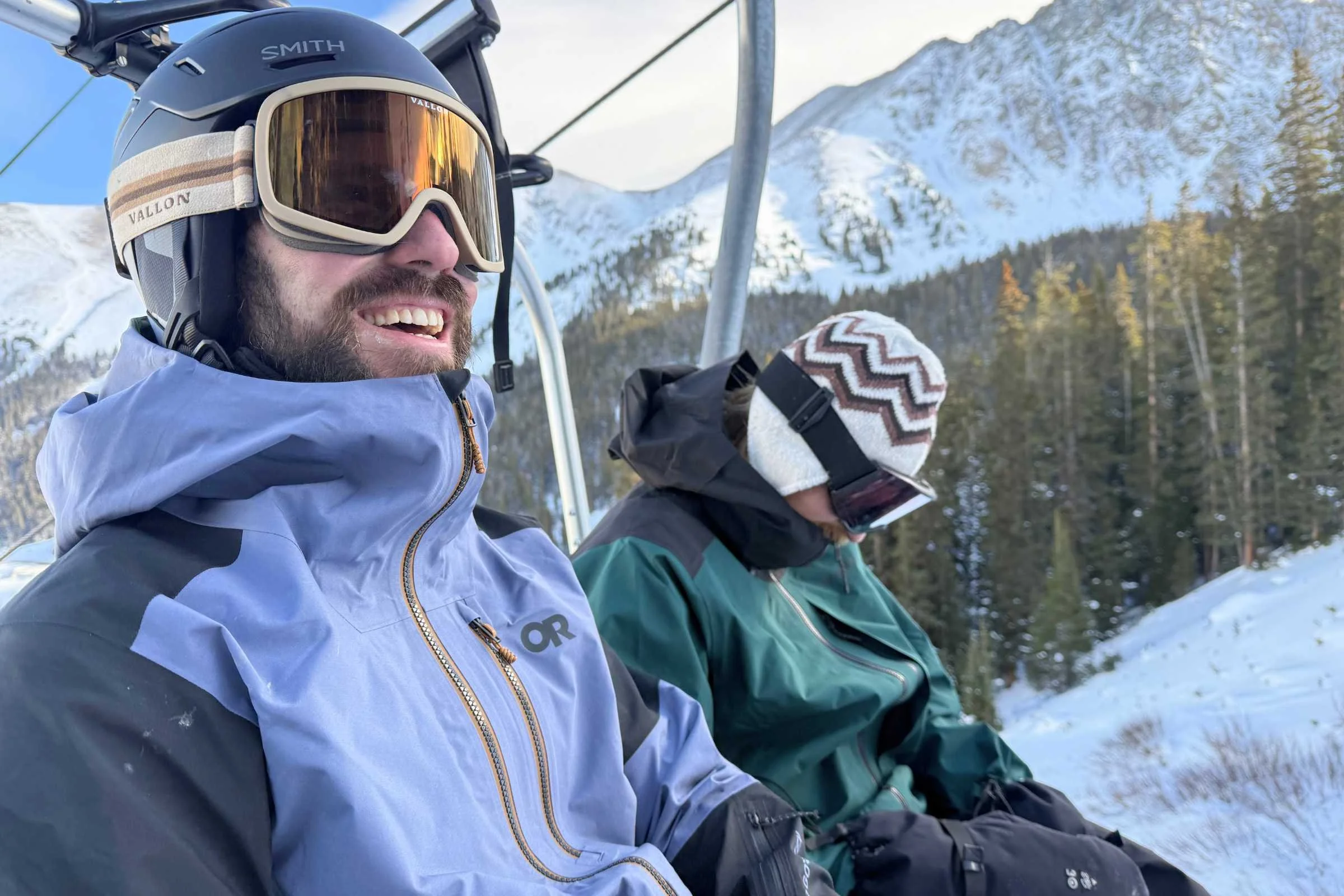   Skier wearing Smith Vantage 2 MIPS helmet on chairlift  