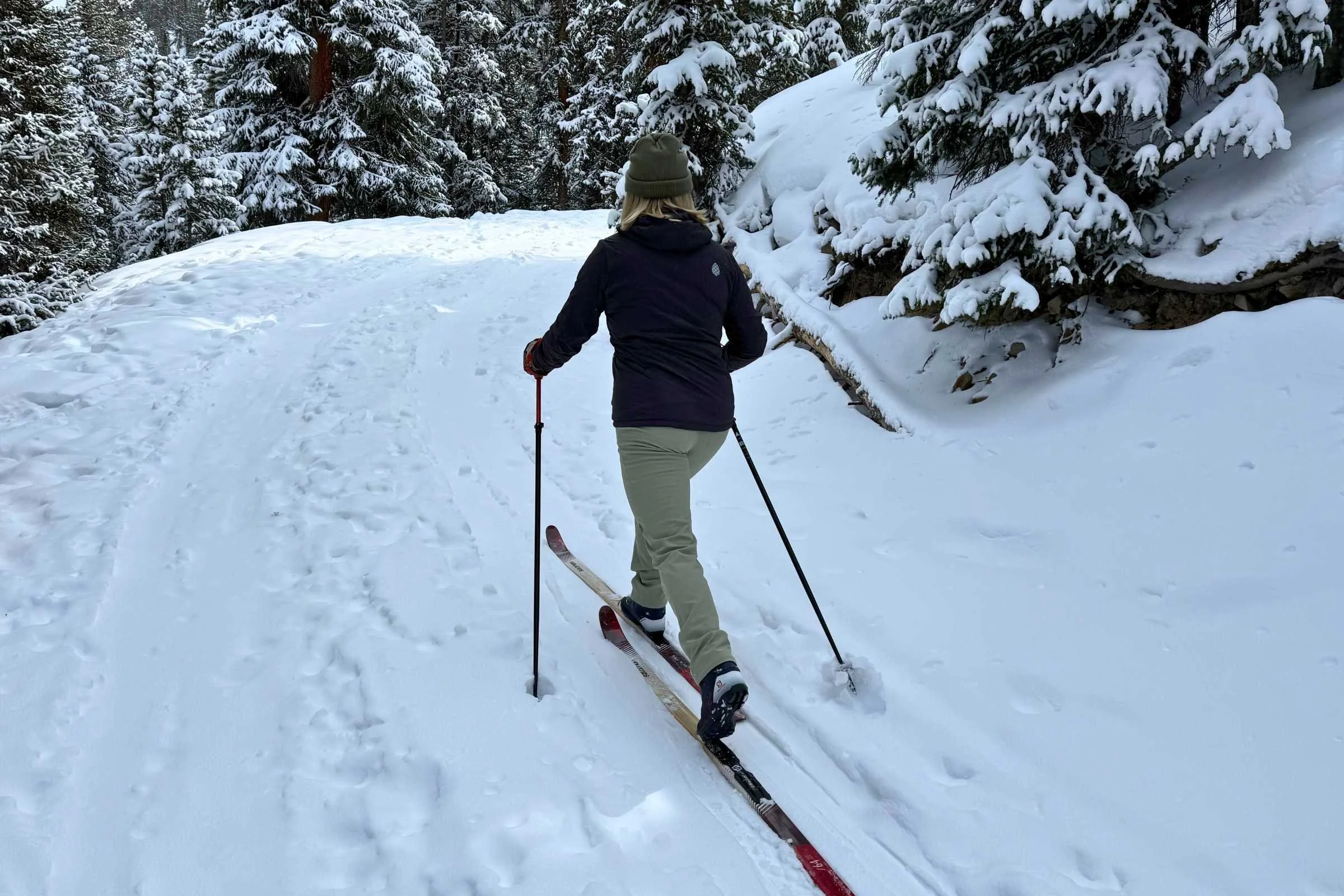   Rear view of Stio Pinedale pants while skiing uphill  