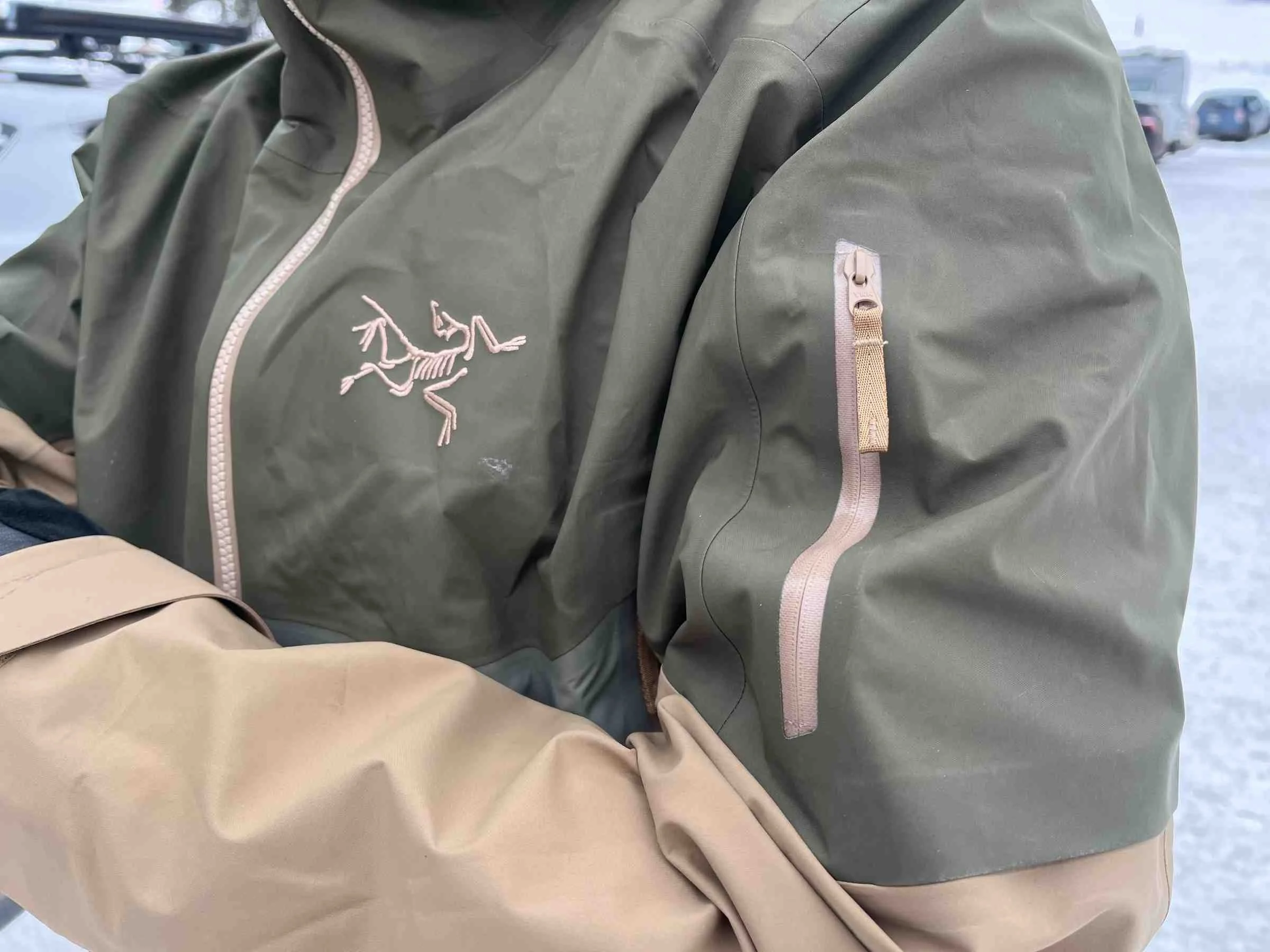   Close-up of Arc'teryx Sabre jacket chest logo and sleeve pocket  
