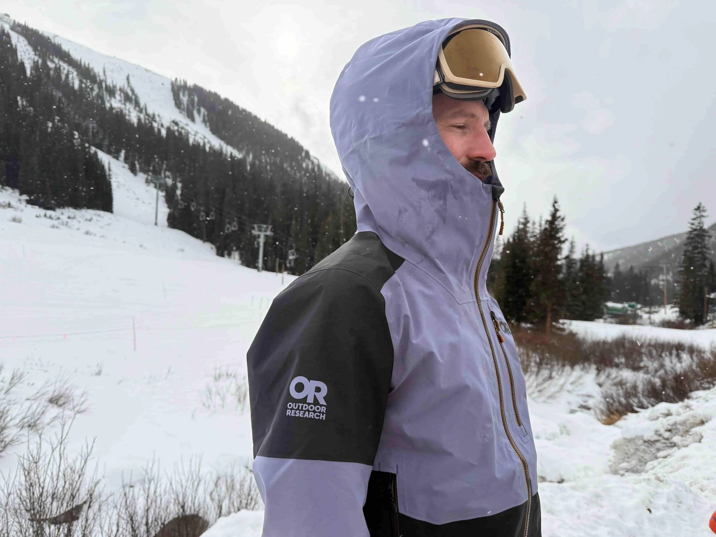   Side view of Outdoor Research Hemispheres ski jacket on snowy slope  