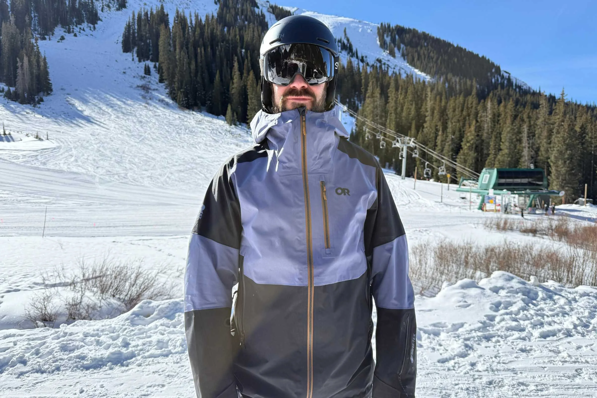   Front view of Outdoor Research Hemispheres ski jacket on mountain  