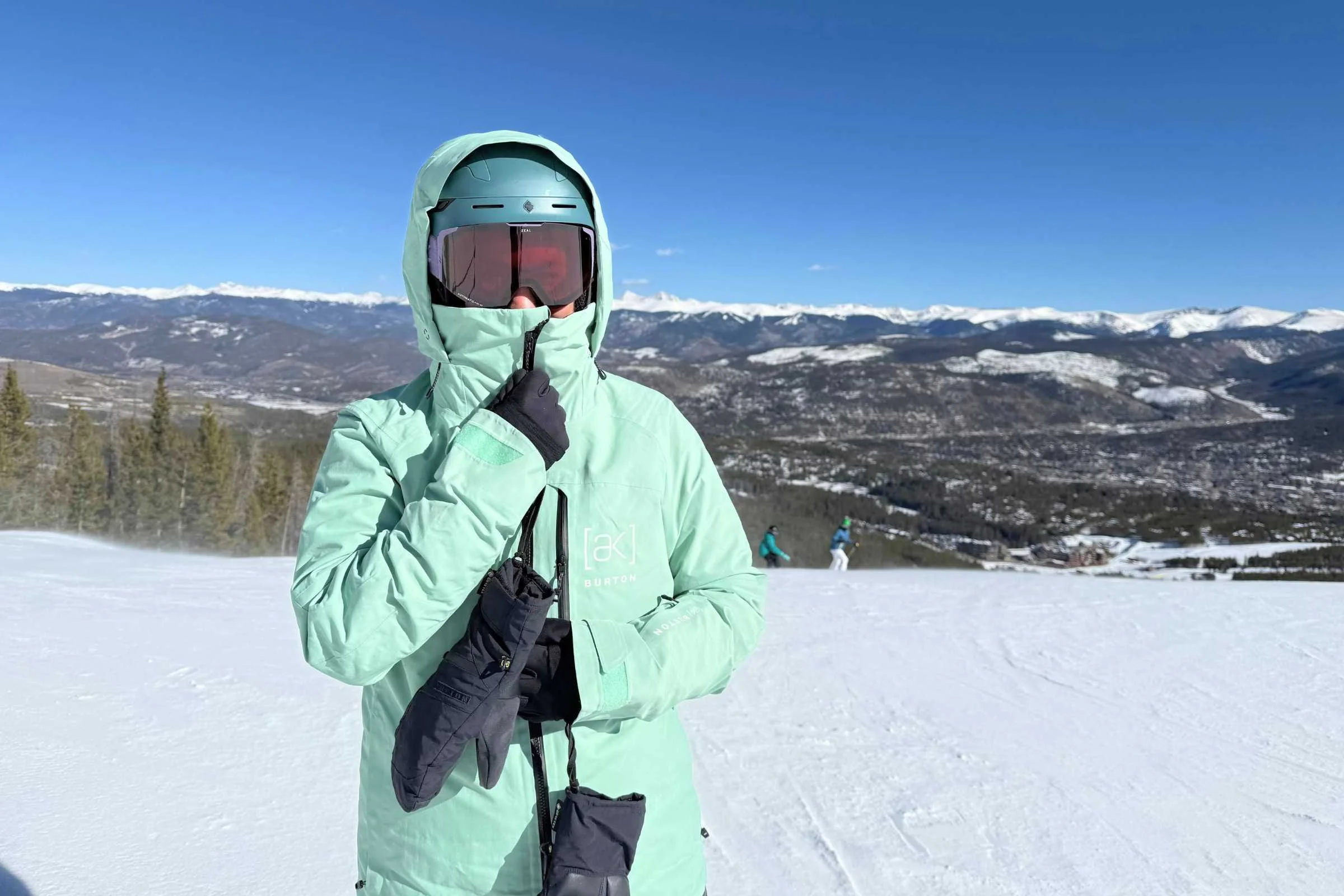   Snowboarder wearing Burton Embark snowboard jacket on snowy mountain  