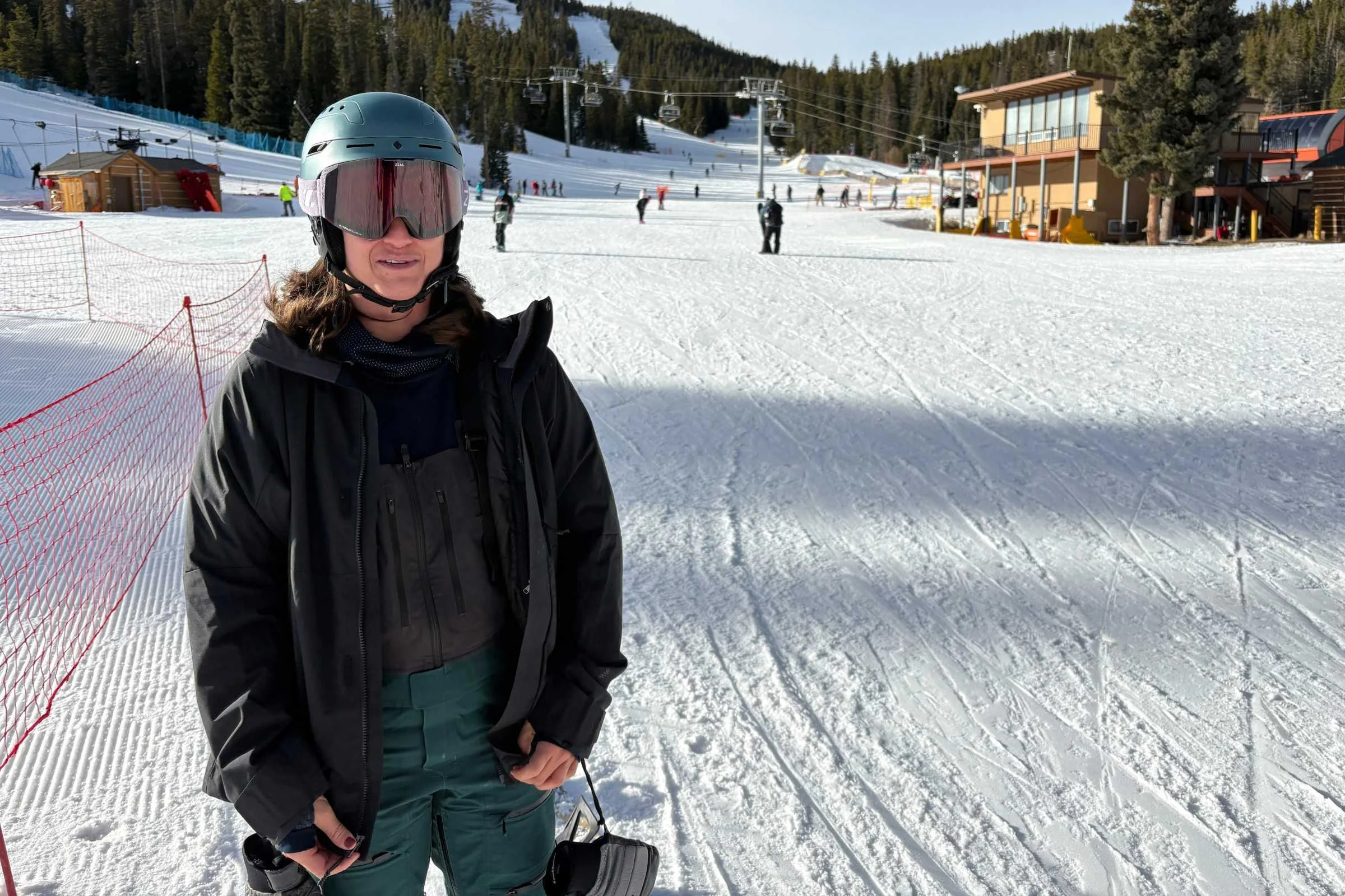   Front view of rider wearing REI Co-op Powderbound Insulated Jacket on slope  