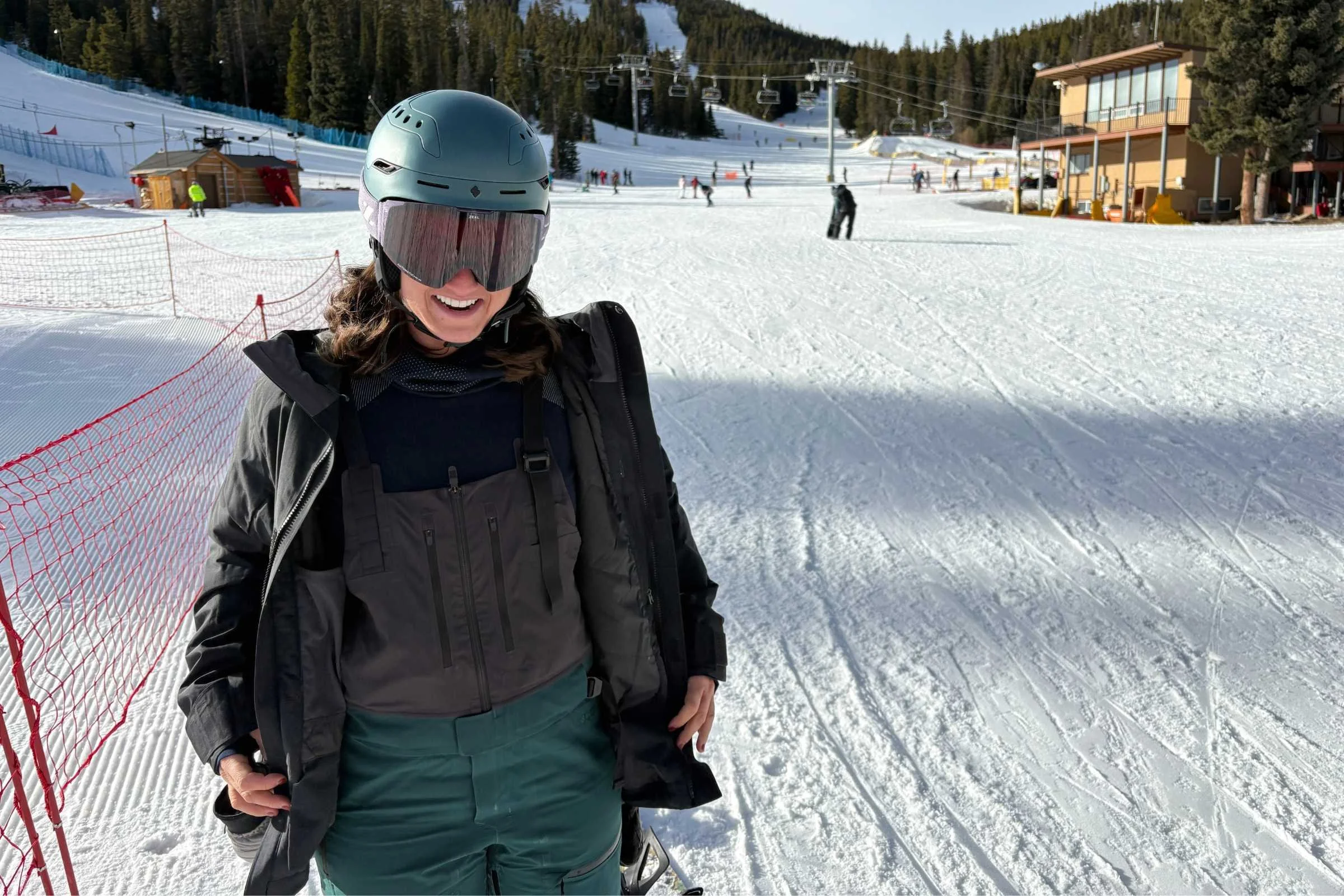   Rider opening REI Co-op Powderbound Insulated Jacket to show fit  