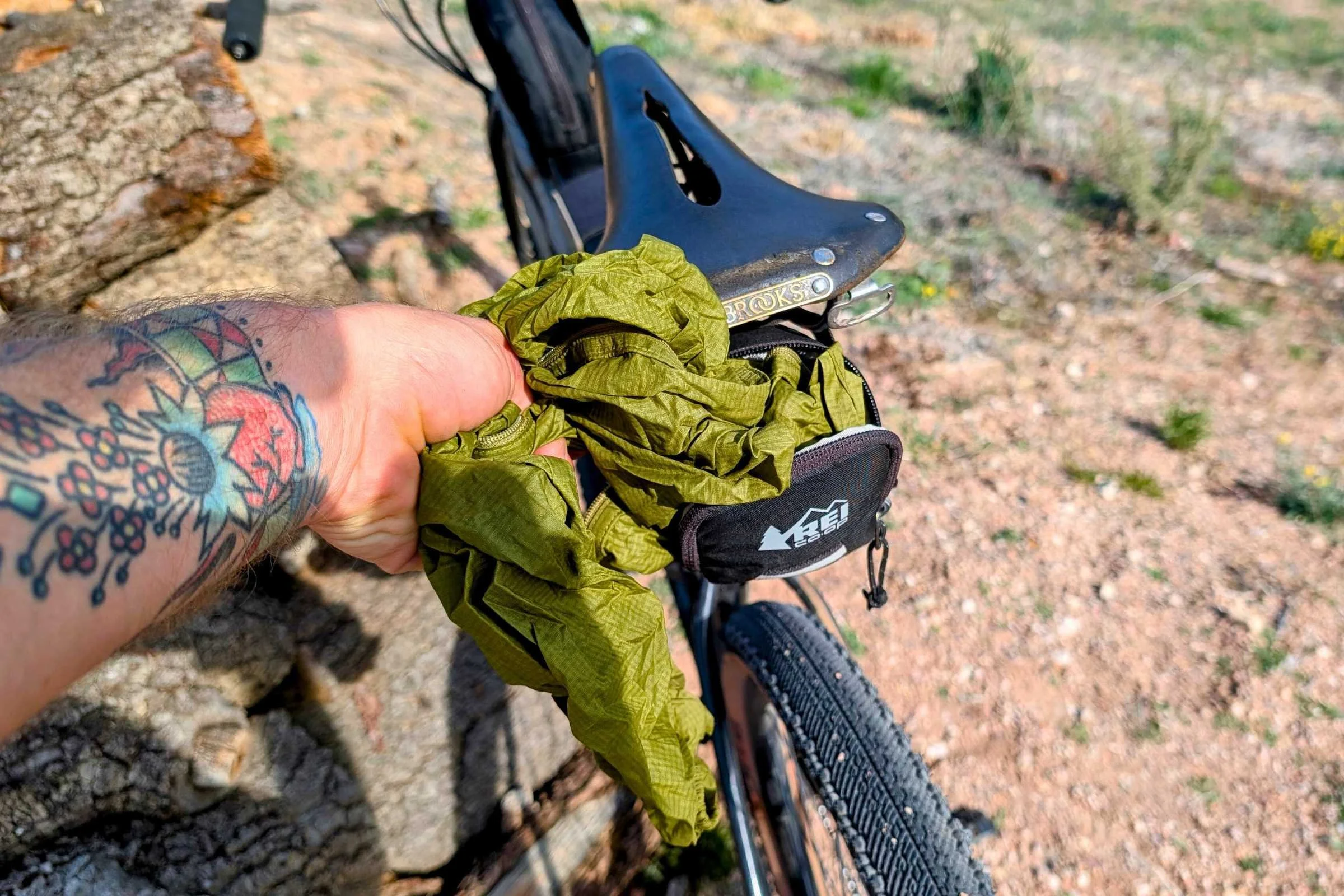   Stuffing a wind jacket into the REI Co-op Junction Seat Wedge  