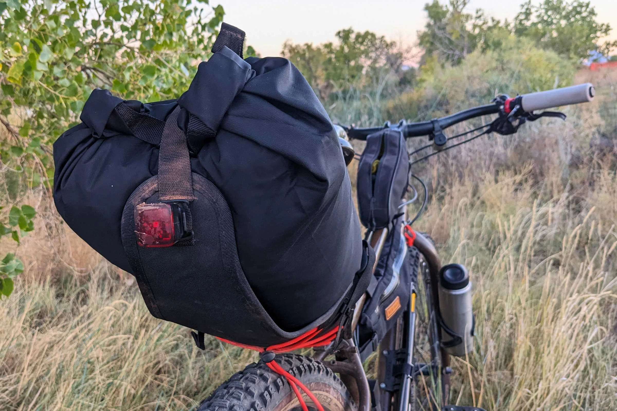   Restrap saddle bag on bike with light attached  