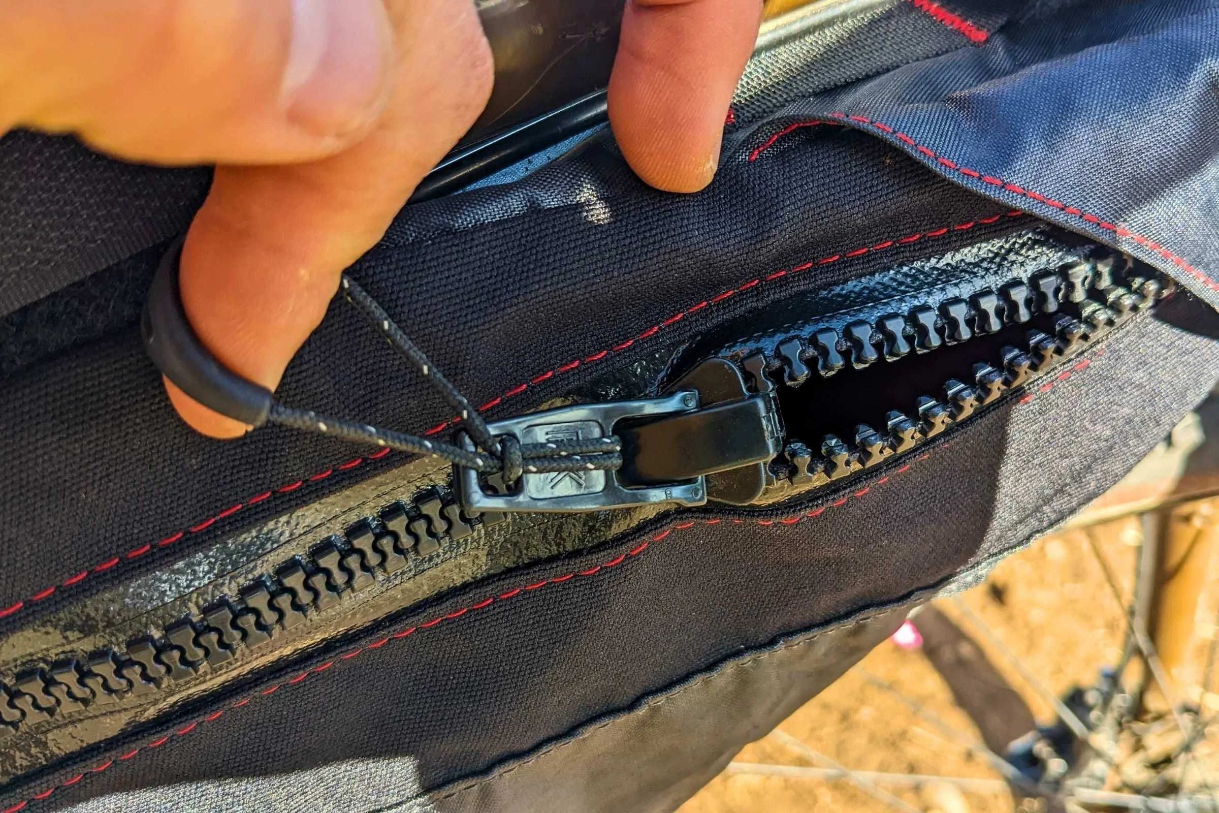   Close-up of high-quality water resistant zippers on the Revelate. They also protect against grit that can jam less robust zippers.  