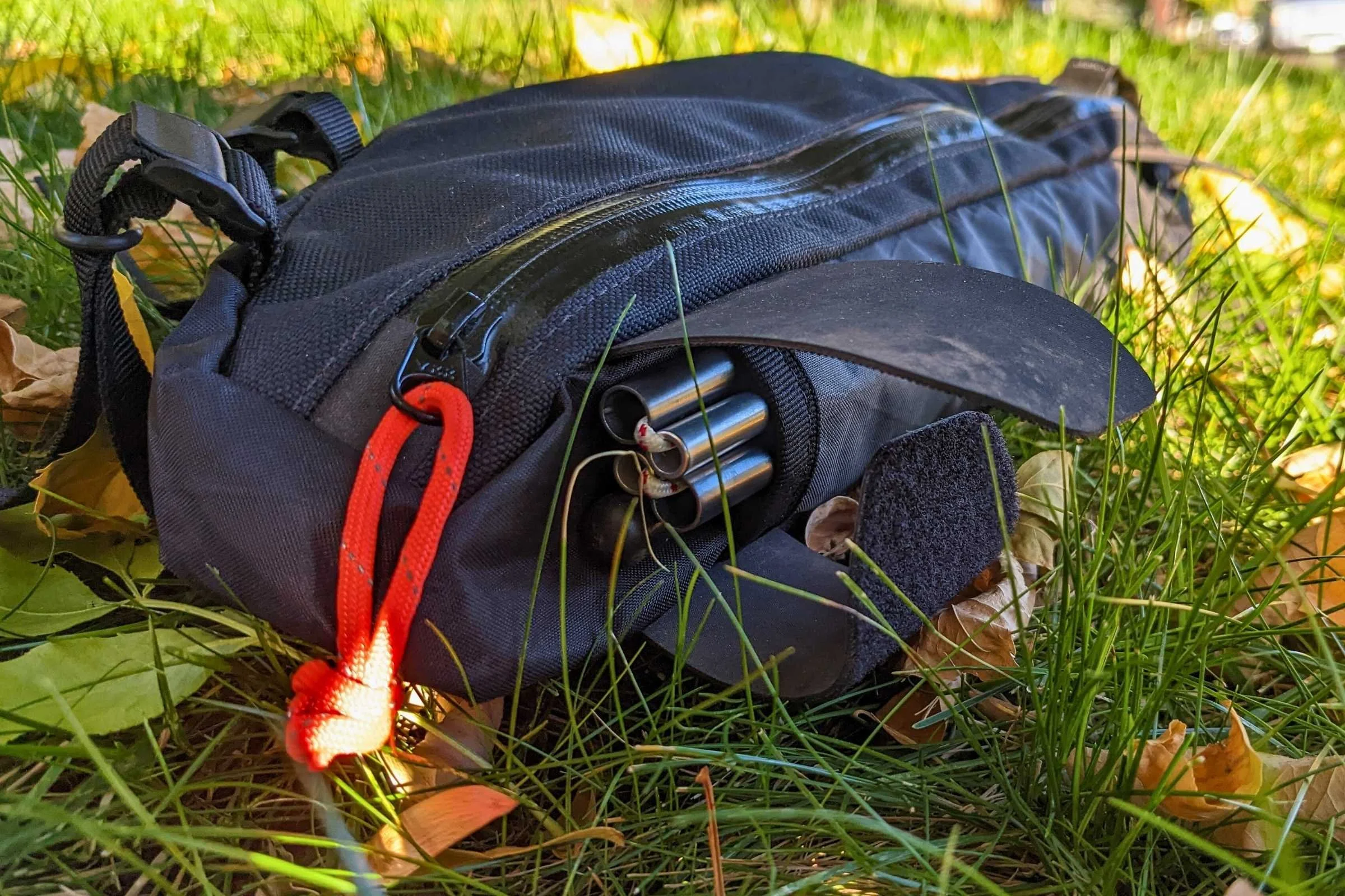   Close-up of the Restrap bike frame bag and how well it fits bikepacking gear, like tent stakes.  