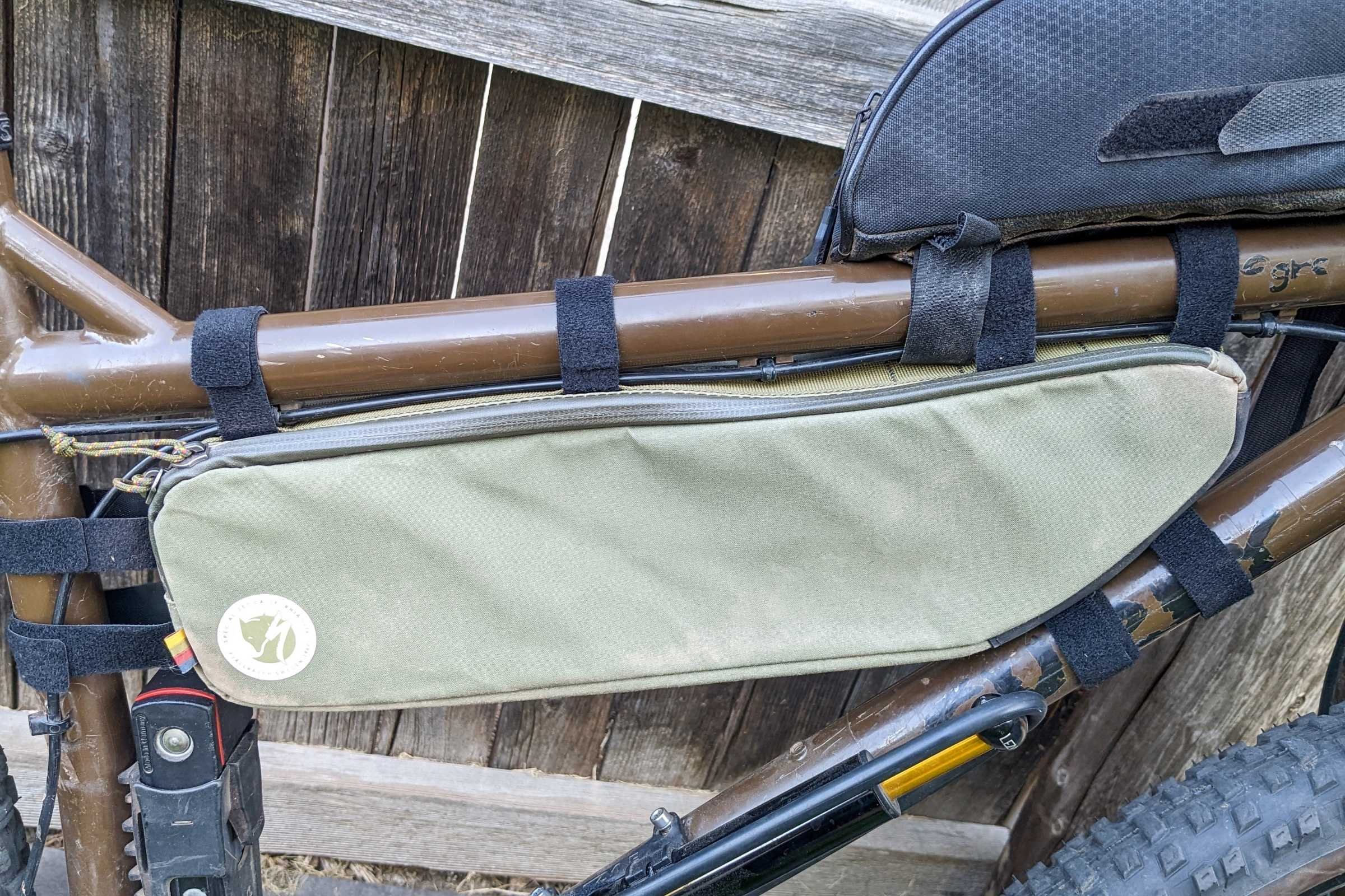   The Specialized-Fjallraven half frame bag is the most rigid of any frame bag we tested. It uses simple Velcro loops for an attachment system.   This makes it excellent for carrying assorted items.  