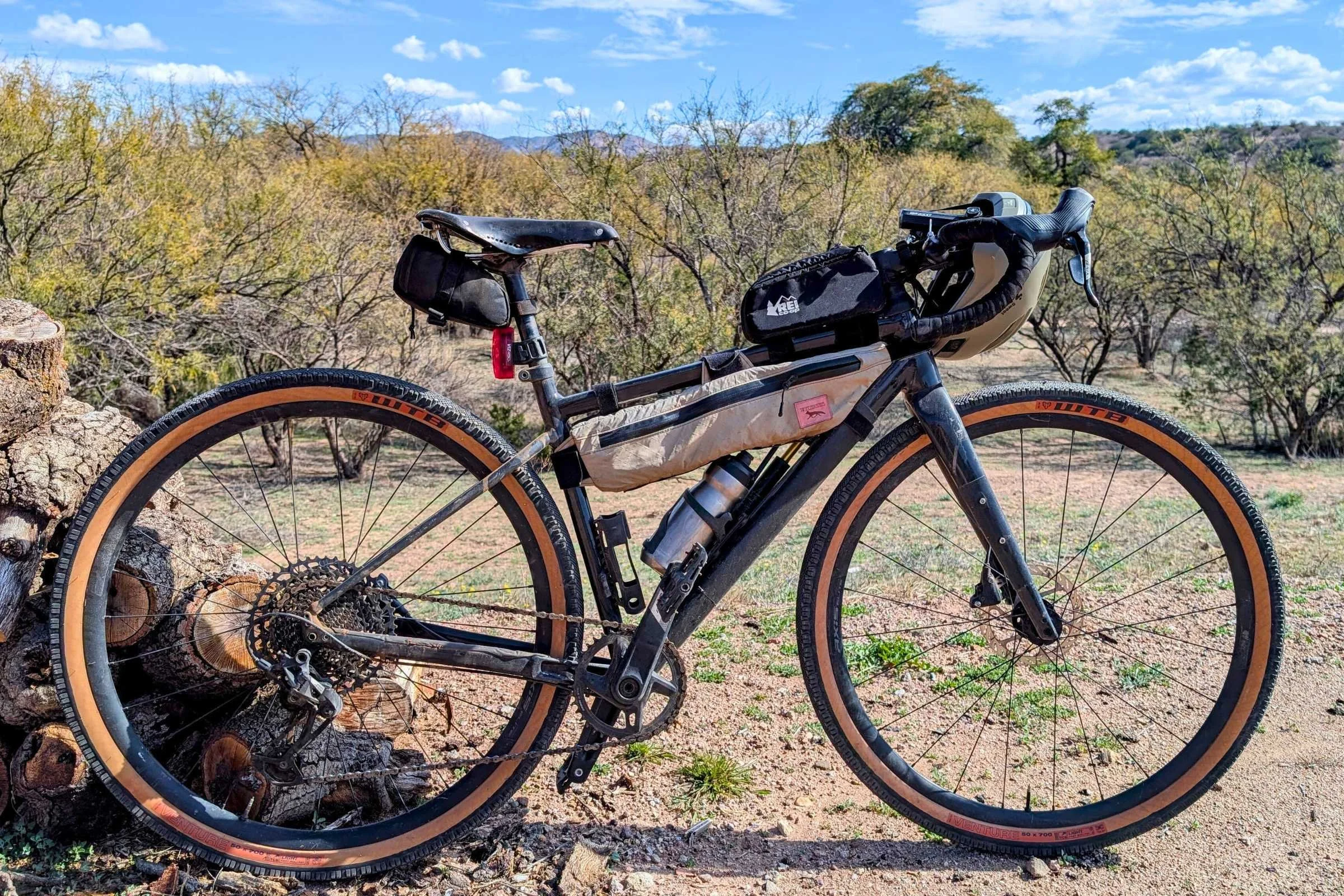  Full gravel bike setup with multiple bikepacking bags, including the Junction Top Tube Bag mounted on the top tube.  