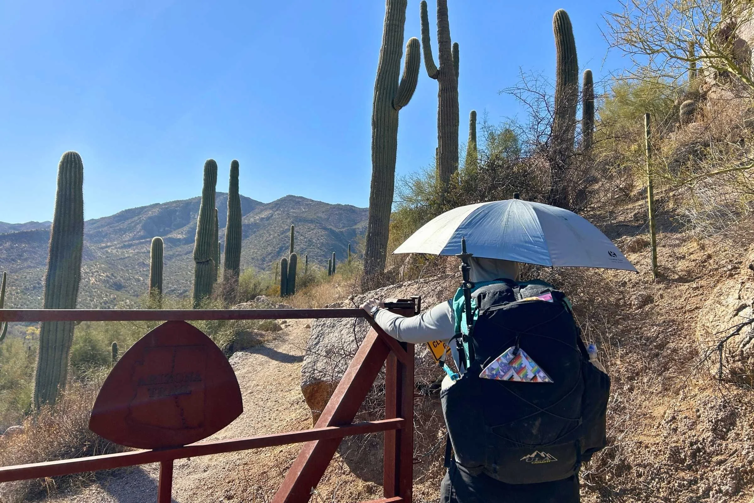   The Lightrek hiking umbrella attaches to your backpack so you can open gates on the Arizona Trail  