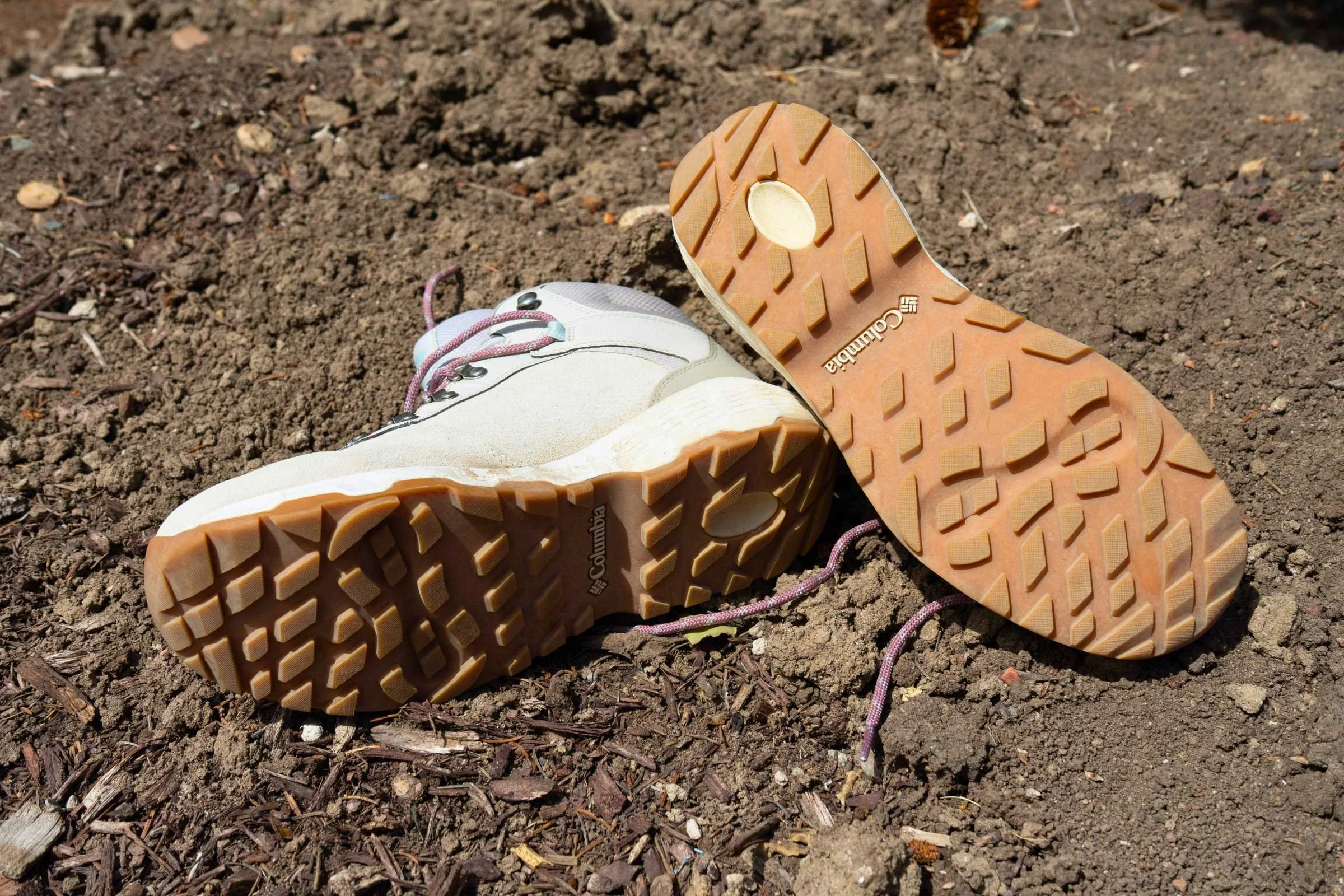   The Columbia Newton Wander hiking boots shown from the outsole view, highlighting the lug pattern and traction  