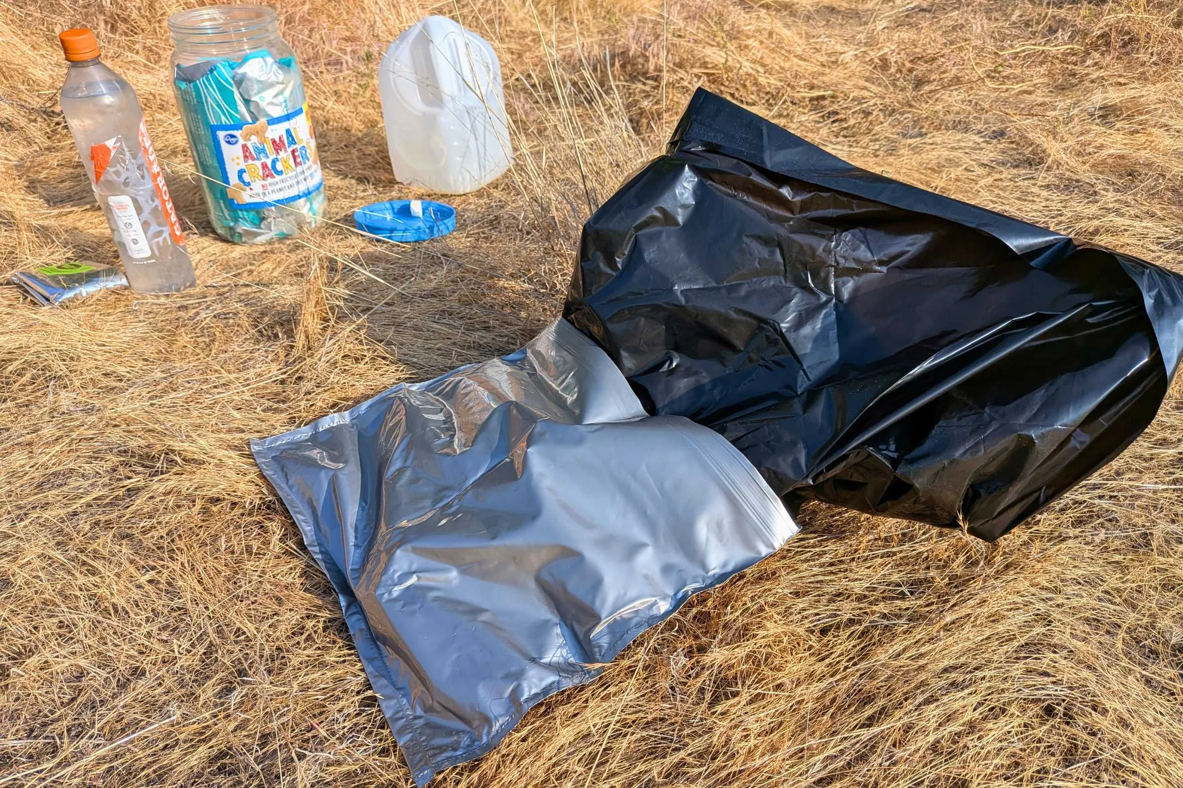   The Camco toilet waste bag system laid out before use, showing the outer disposal bag and inner waste bag.  