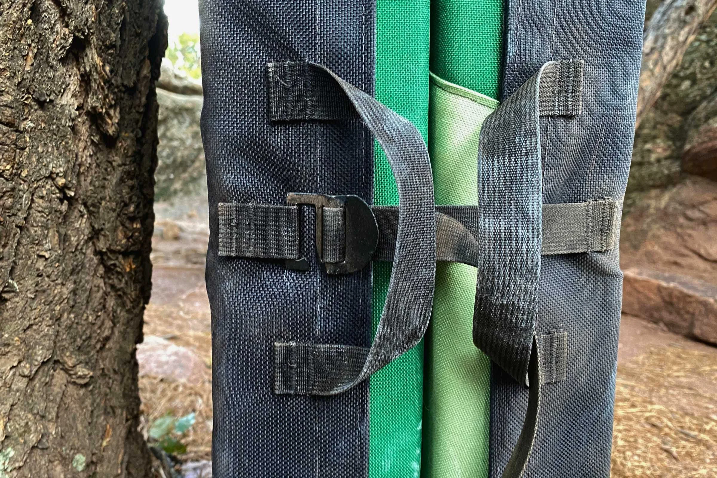   The Simple Pad has a strap that goes under some of the grab handles, which can be a little annoying to use.  