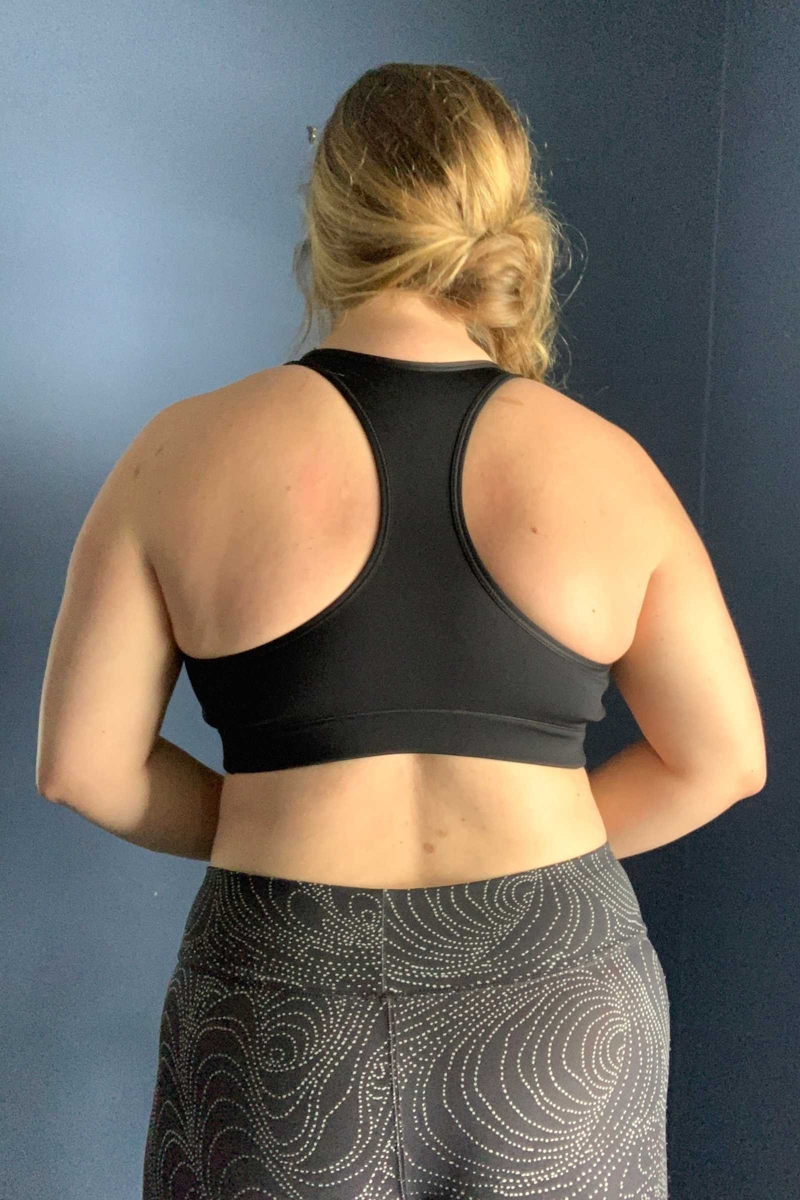   Rear angle of the Nike Swoosh sports bra showing strap placement and back support fit.  