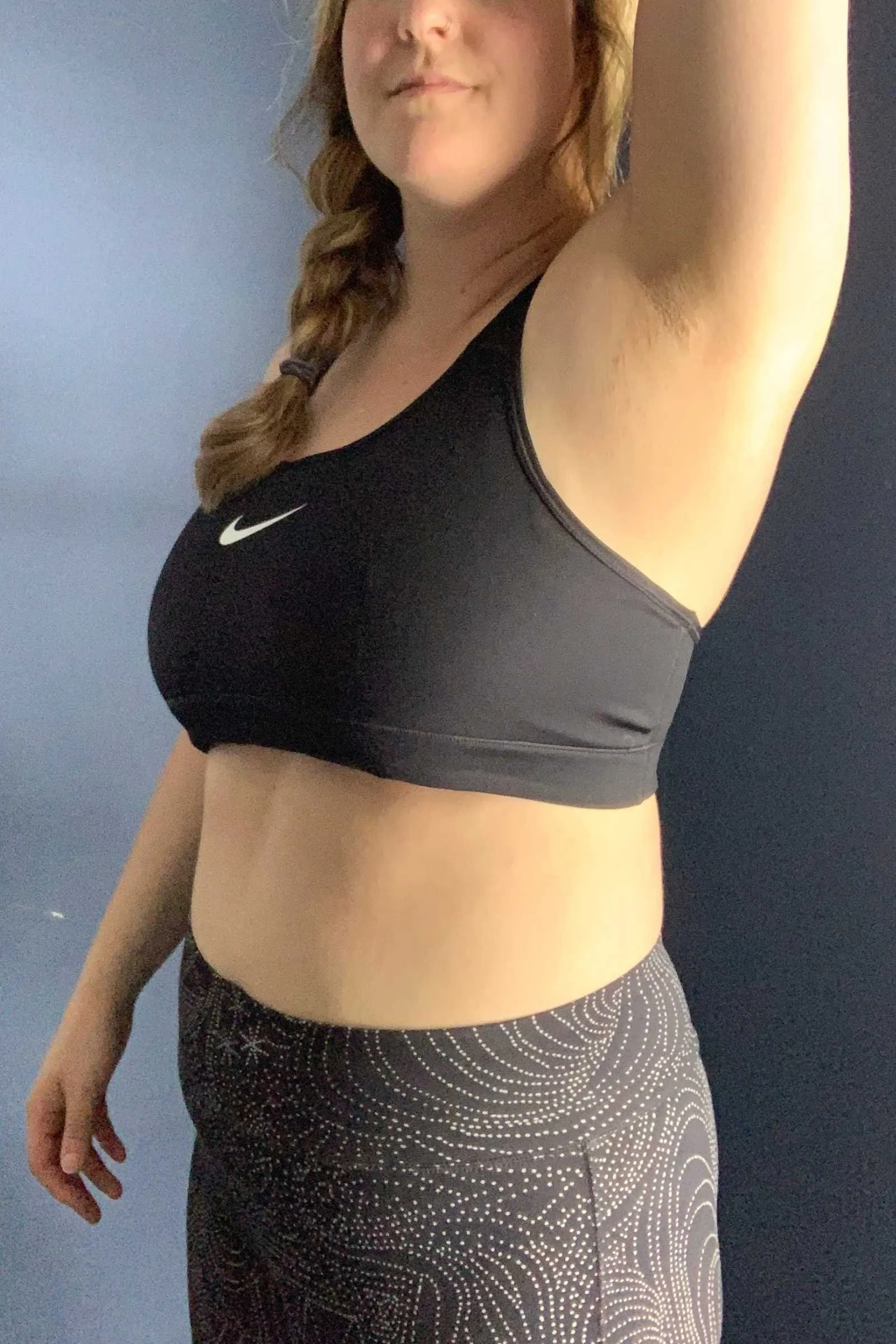   Side profile of the Nike Swoosh sports bra showing fit through the bust and underband.  