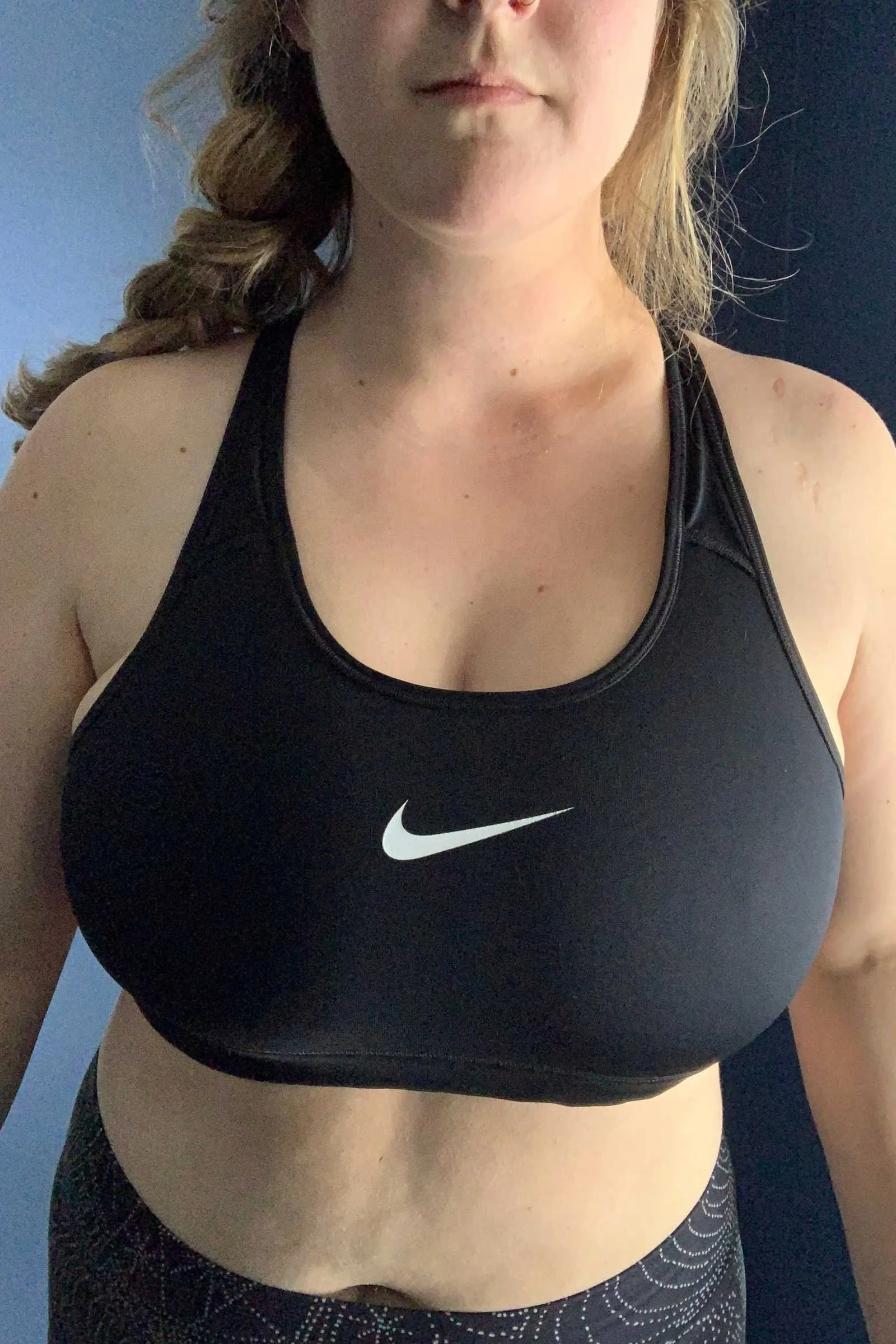   Front close-up of the Nike Swoosh sports bra showing neckline, cup fit, and support.  