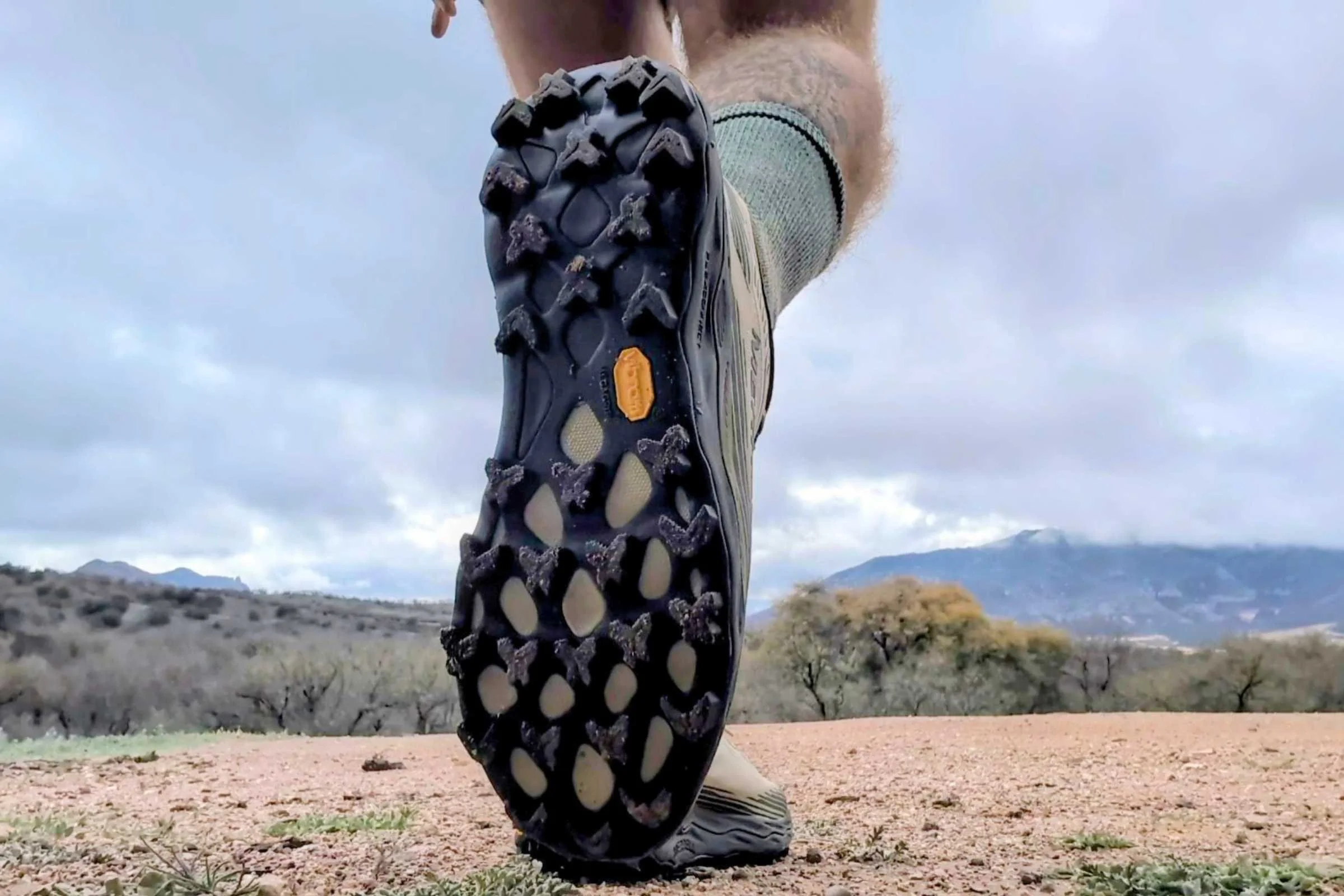   Outsole view of the Merrell Agility Peak 6 trail running shoe showing deep trail lugs and tread pattern.  