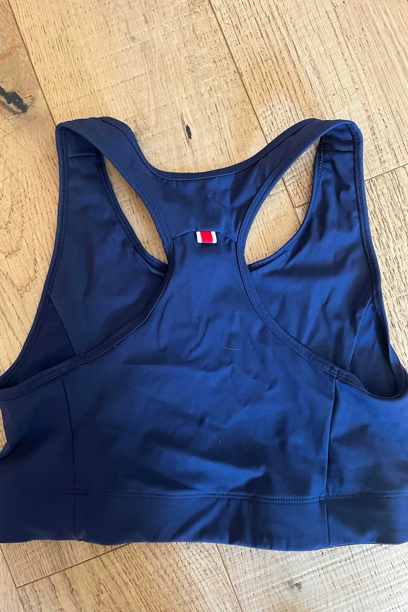   The back of the Tracksmith Allston bra is simple and supportive. The fabric is among the most breathable and wicking of the sports bras we tested. It doesn’t feel too warm, even to our Southern California tester who runs throughout the summer heat.