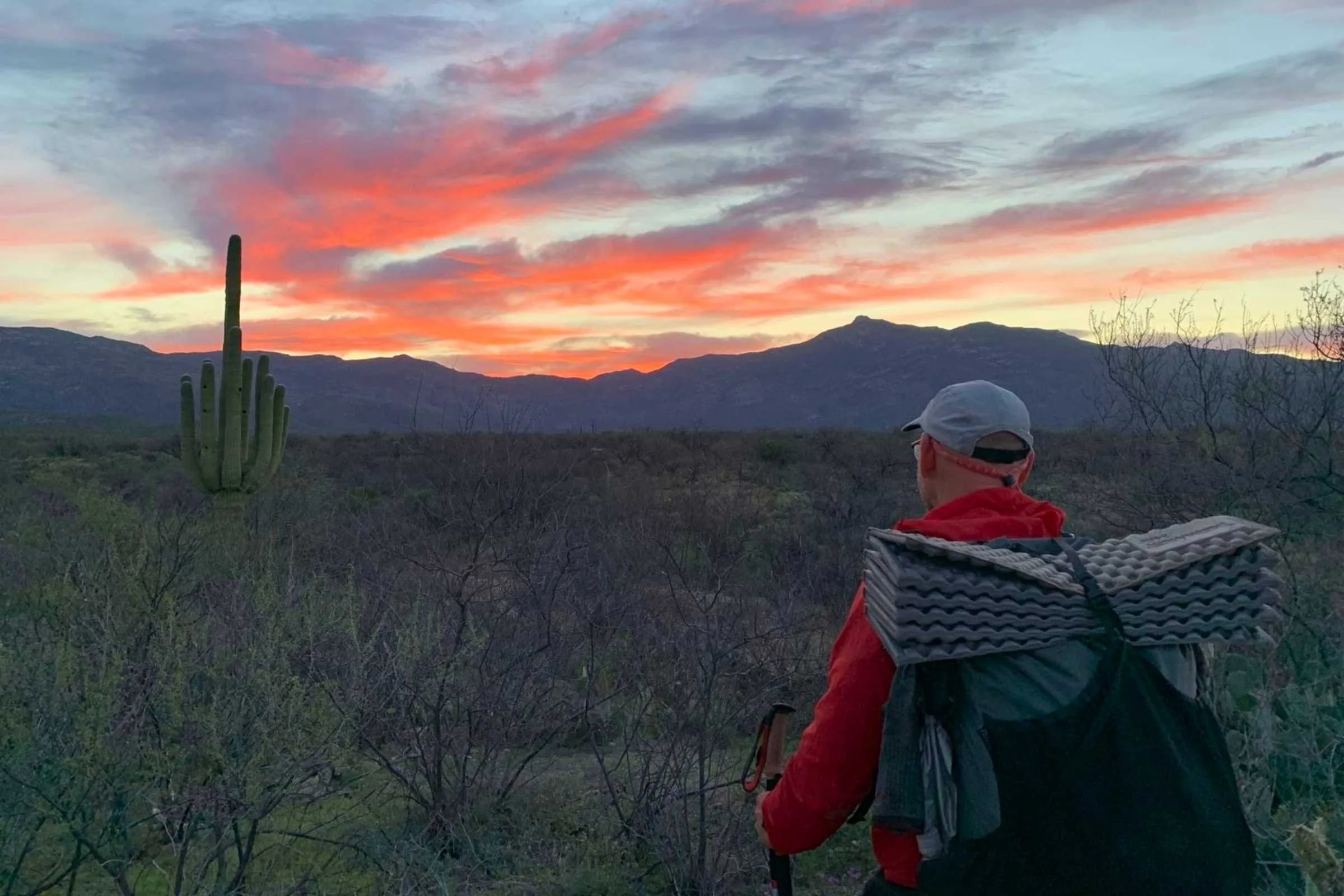   Hiking at sunset in the desert wearing the Outdoor Research Sun Runner Cap  