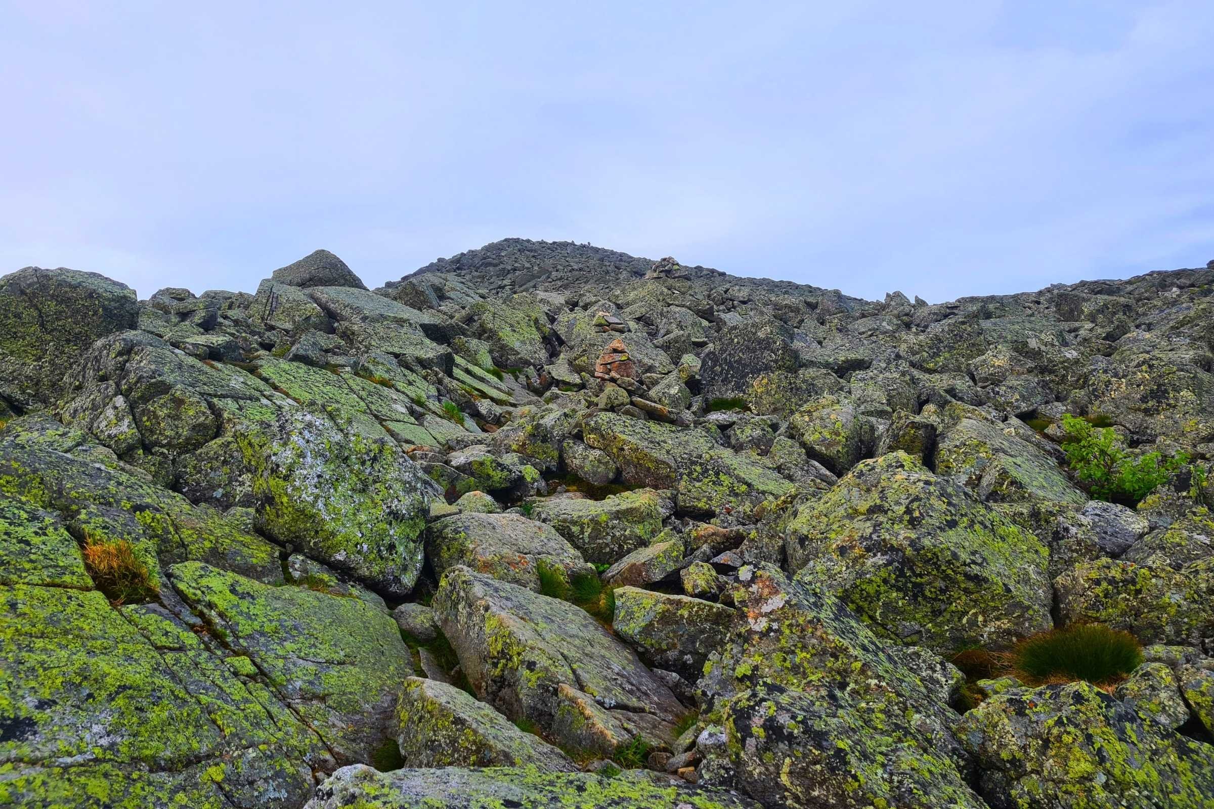   Rocky alpine terrain on the Presidential Traverse Trail with large boulders.  