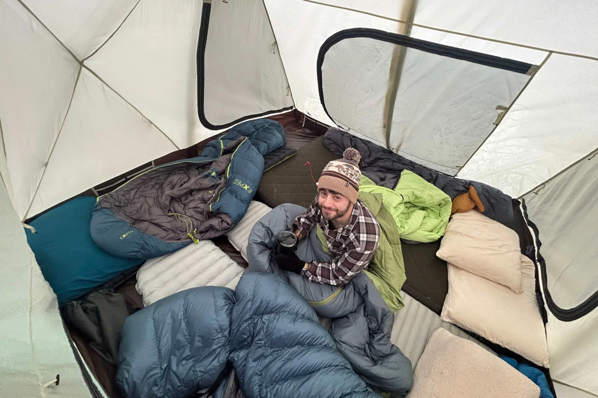   Overhead interior view of Snow Peak Alpha Breeze tent showing spacious floor layout and sleeping setup for multiple campers  