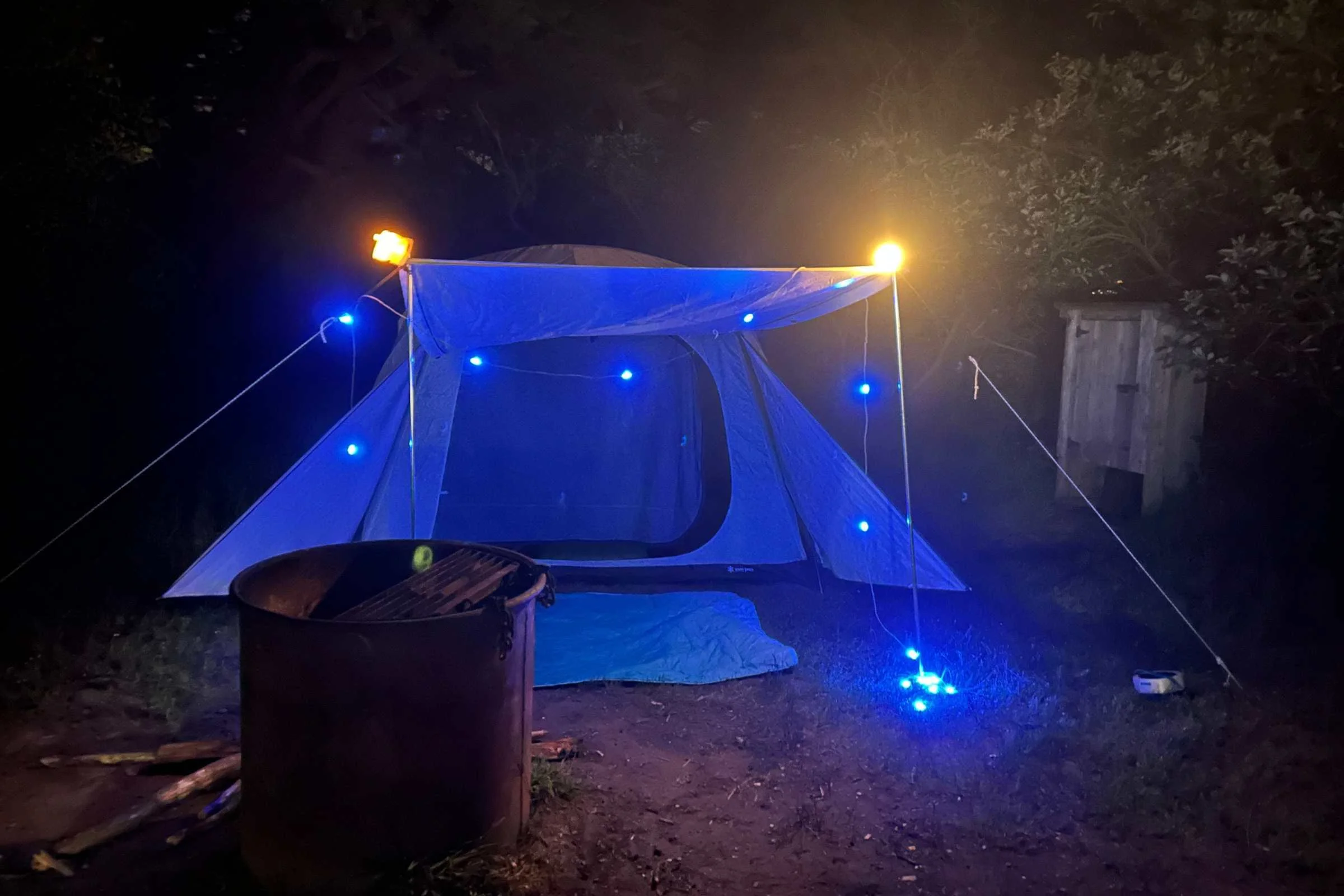  Snow Peak Alpha Breeze camping tent set up at night with string lights and campsite lighting during overnight camping test  