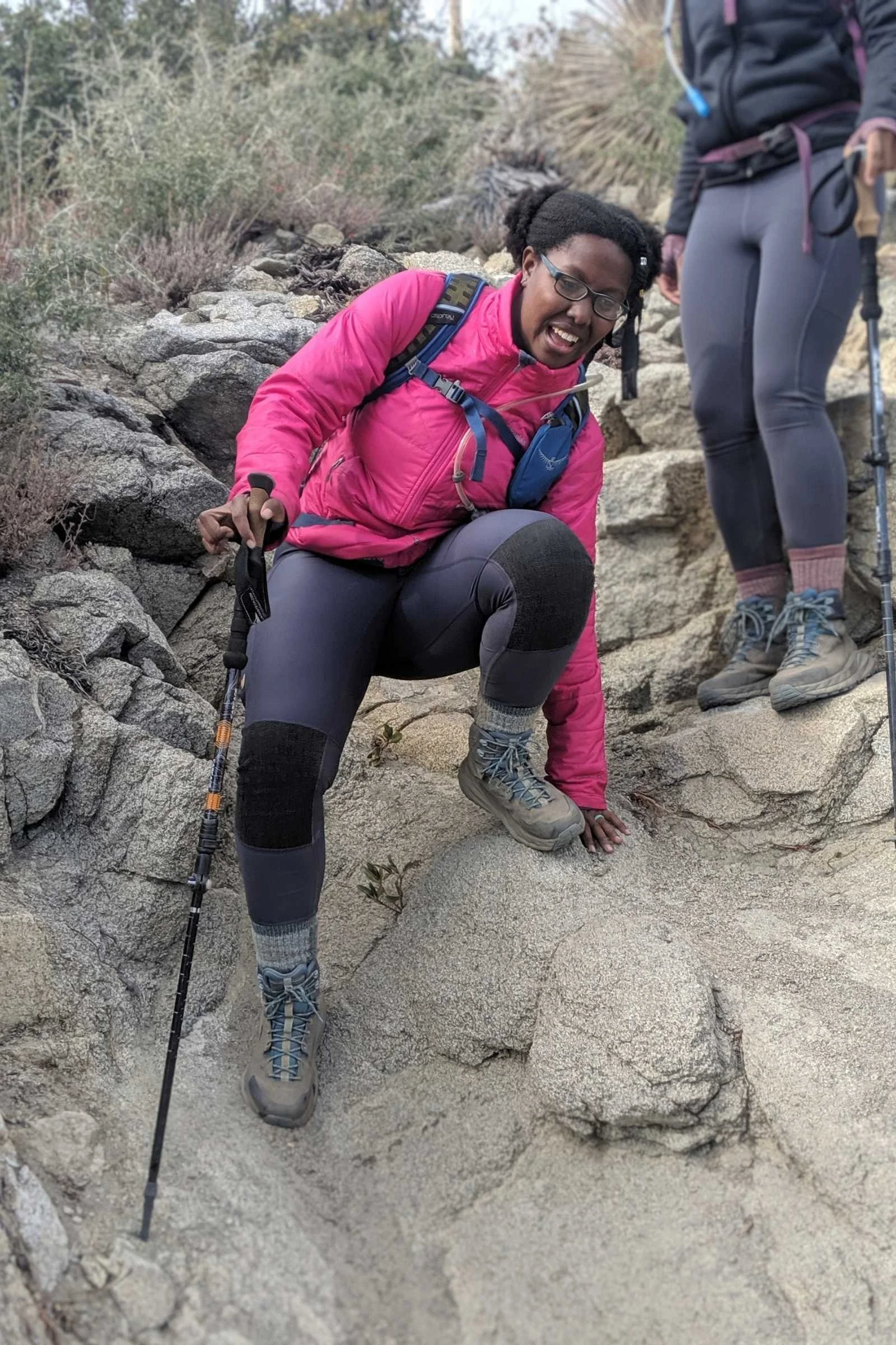   Hiker wearing REI Co-op Merino Wool Lightweight Hiking Crew Socks doing a rocky downhill scramble  