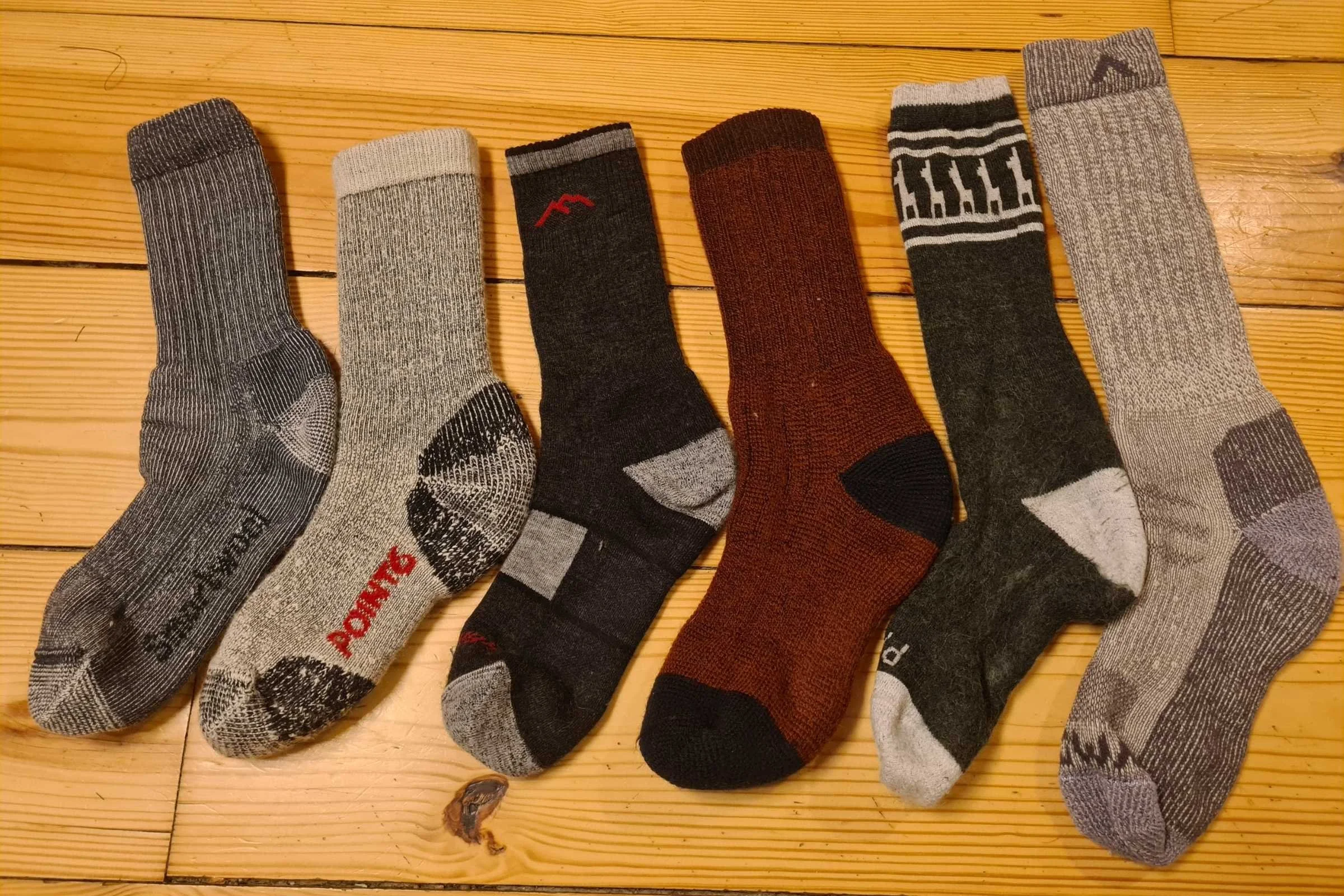   A variety of Smartwool Hike Classic Full Cushion socks laid out in a row  