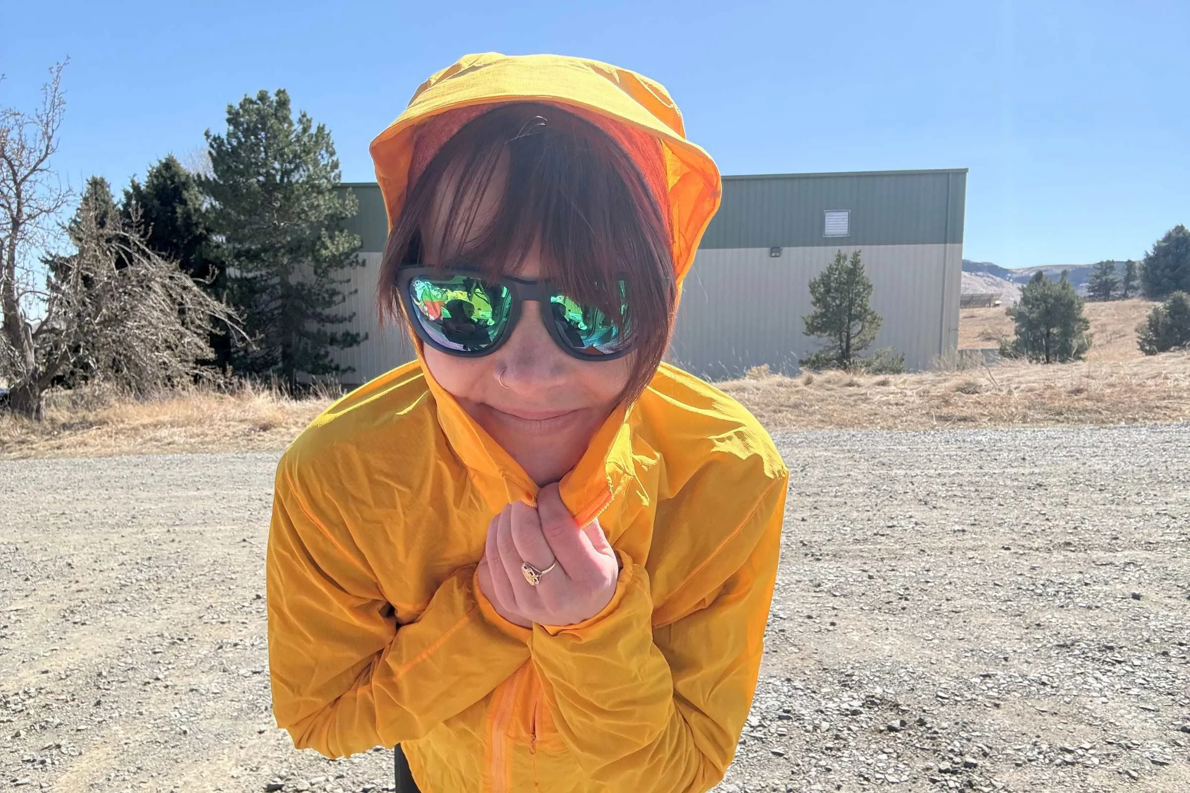   Close-up of woman in yellow hooded wind jacket wearing Knockaround Premiums Sport Polarized Sunglasses  